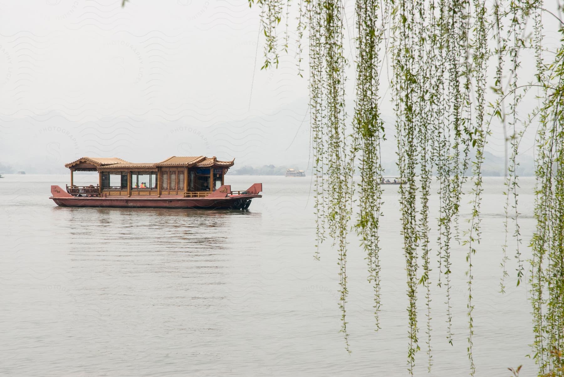 A boat sailing on a lake outdoors