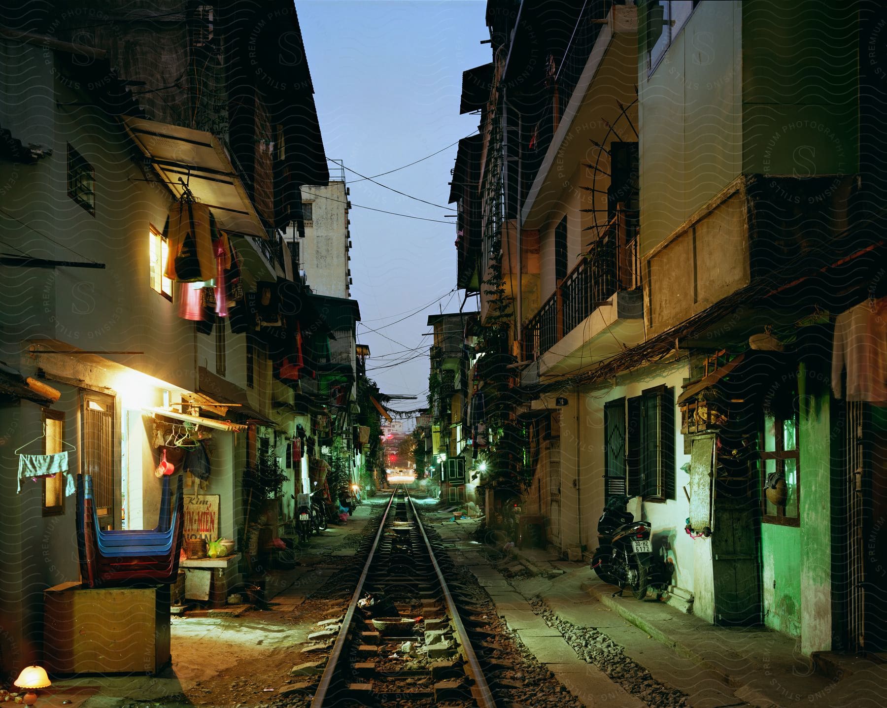 Slum houses with a train rail between them