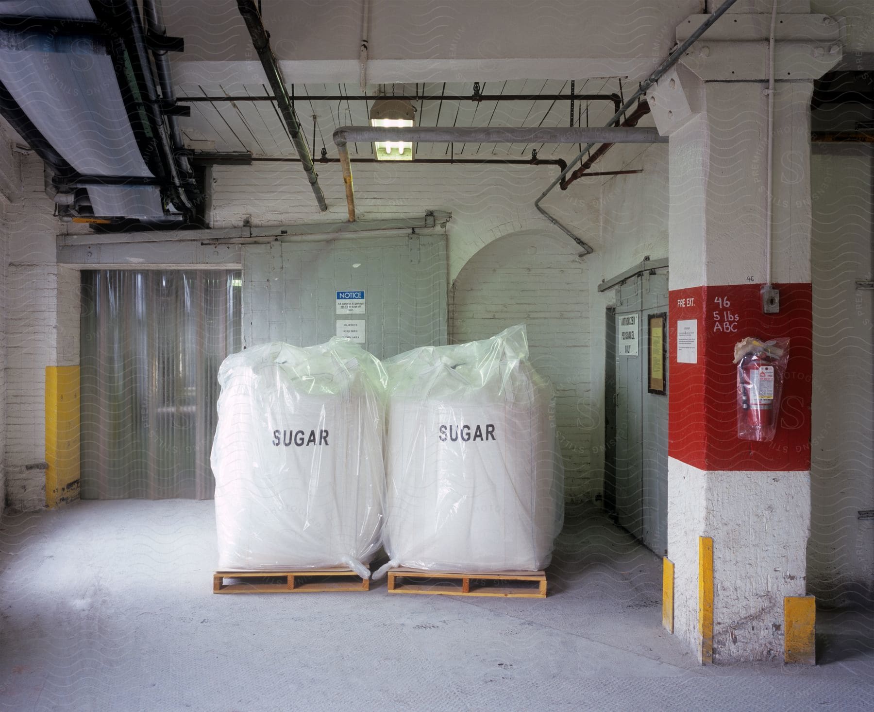 Interior of a factory with big bags of sugar