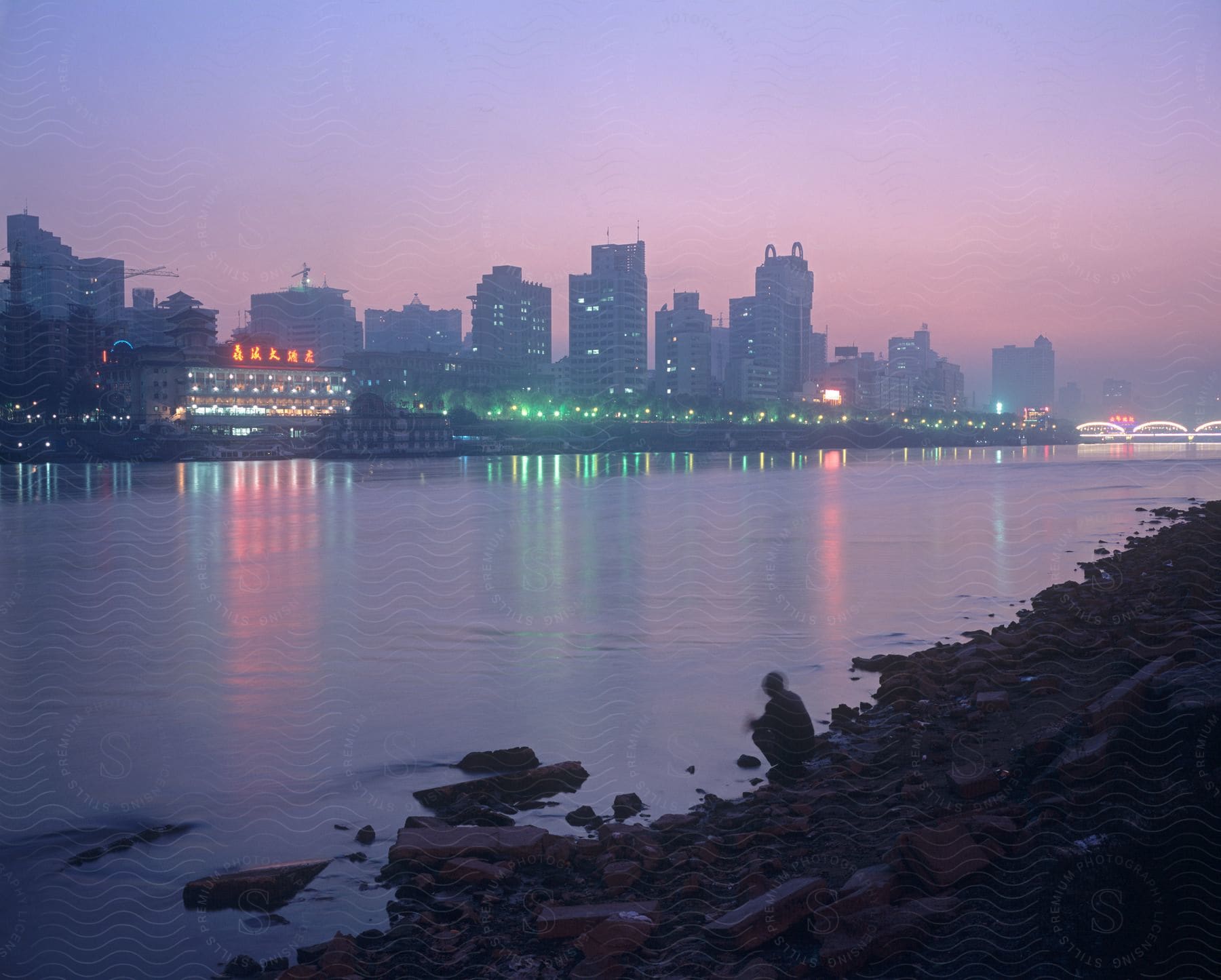 Waterfront skyscrapers and high rise buildings in the city at dawn