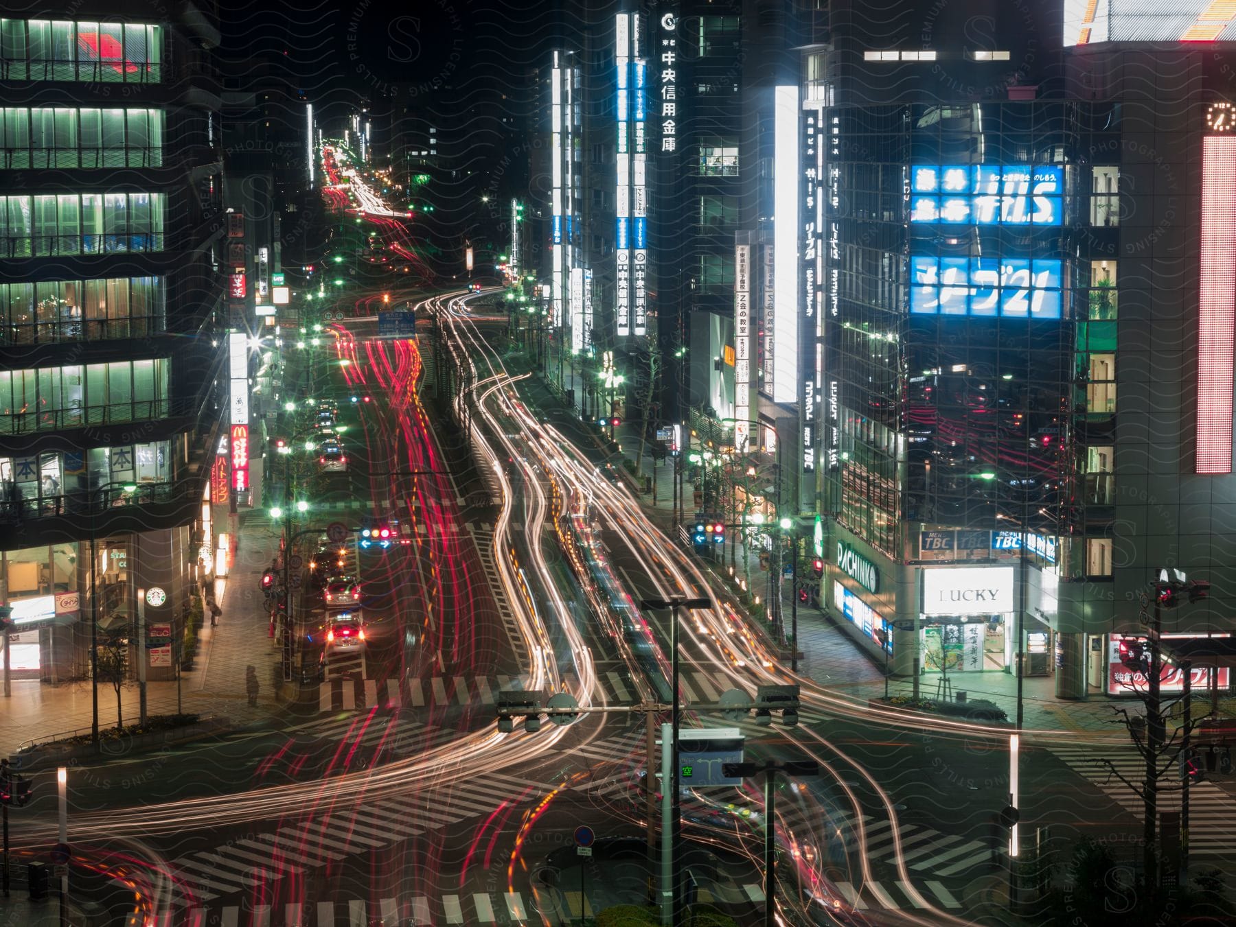 Stock photo of traffic on a wide city street surrounded by skyscrapers