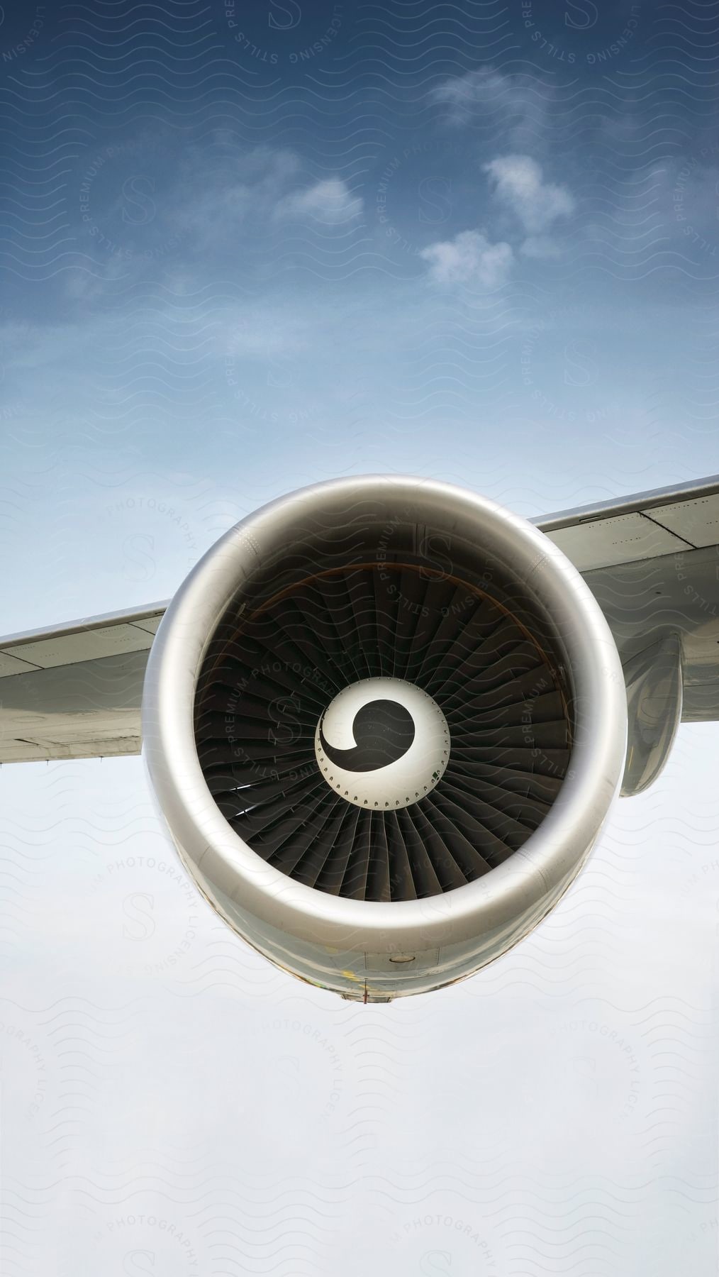 White Swirl Decorates Center Of Jet Turbine Engine On Cloudy Day