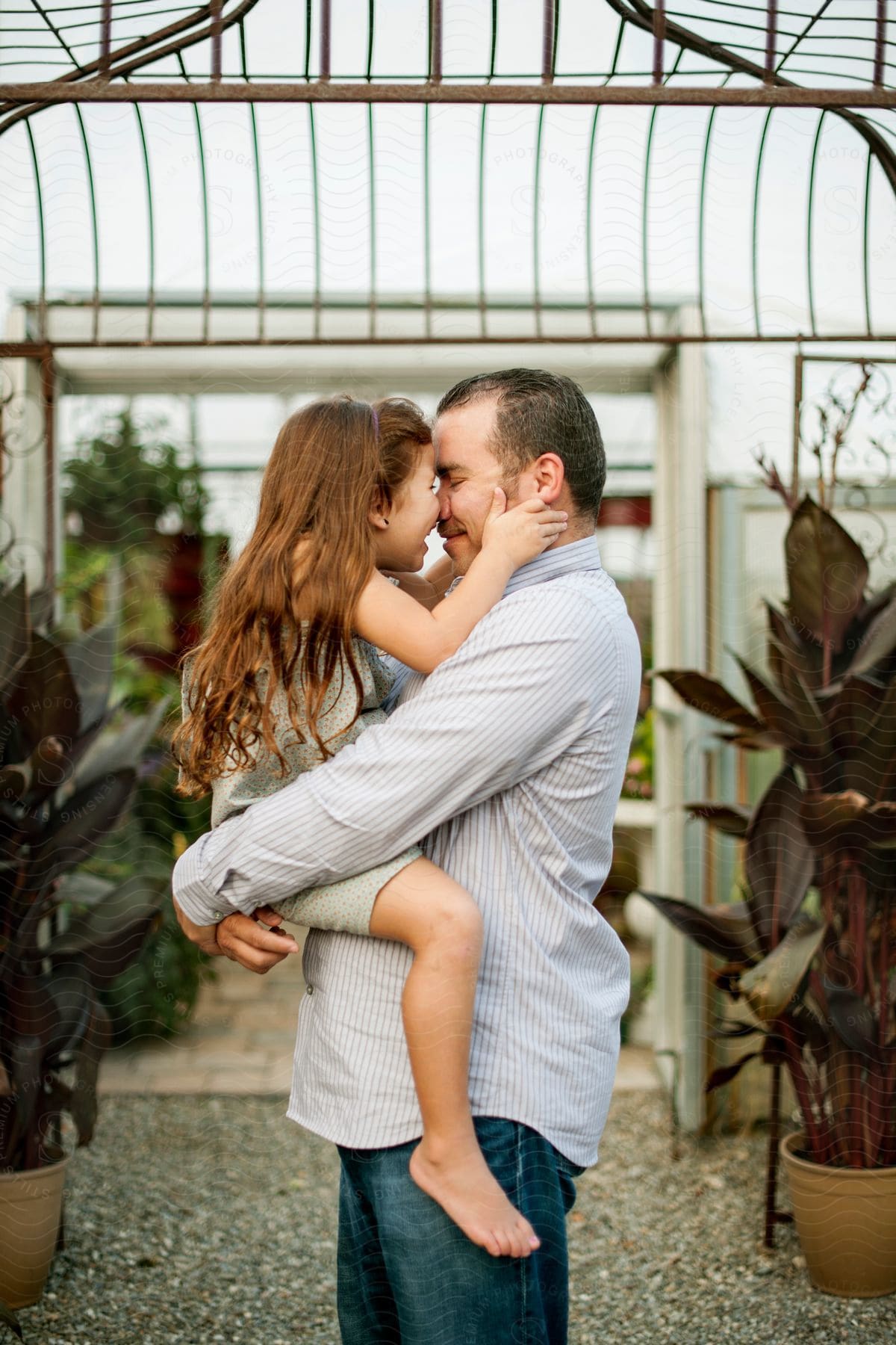 A father and daughter share a close embrace