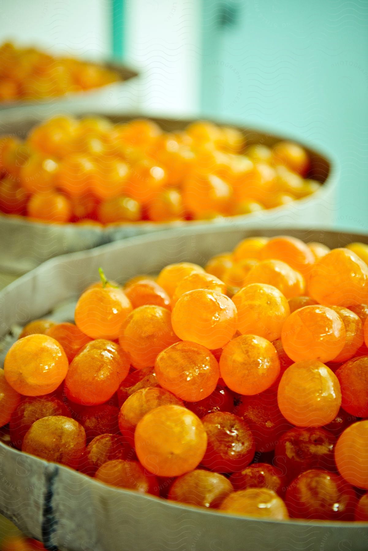 Candied fruit placed on three separate bowls