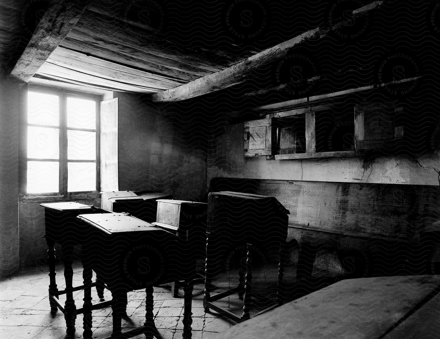 An empty room with wooden furniture and a blackandwhite style