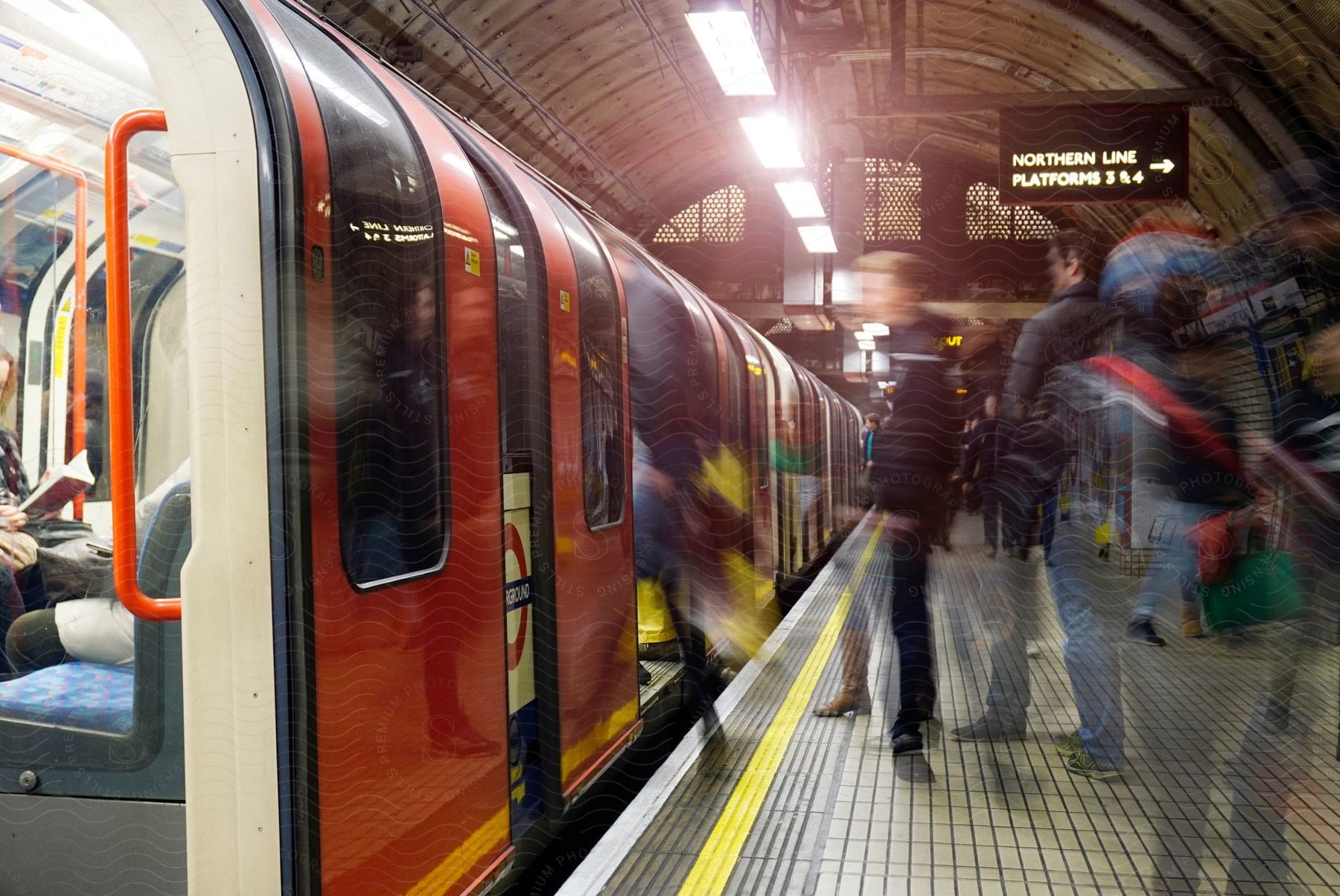 People boarding the subway at an underground station