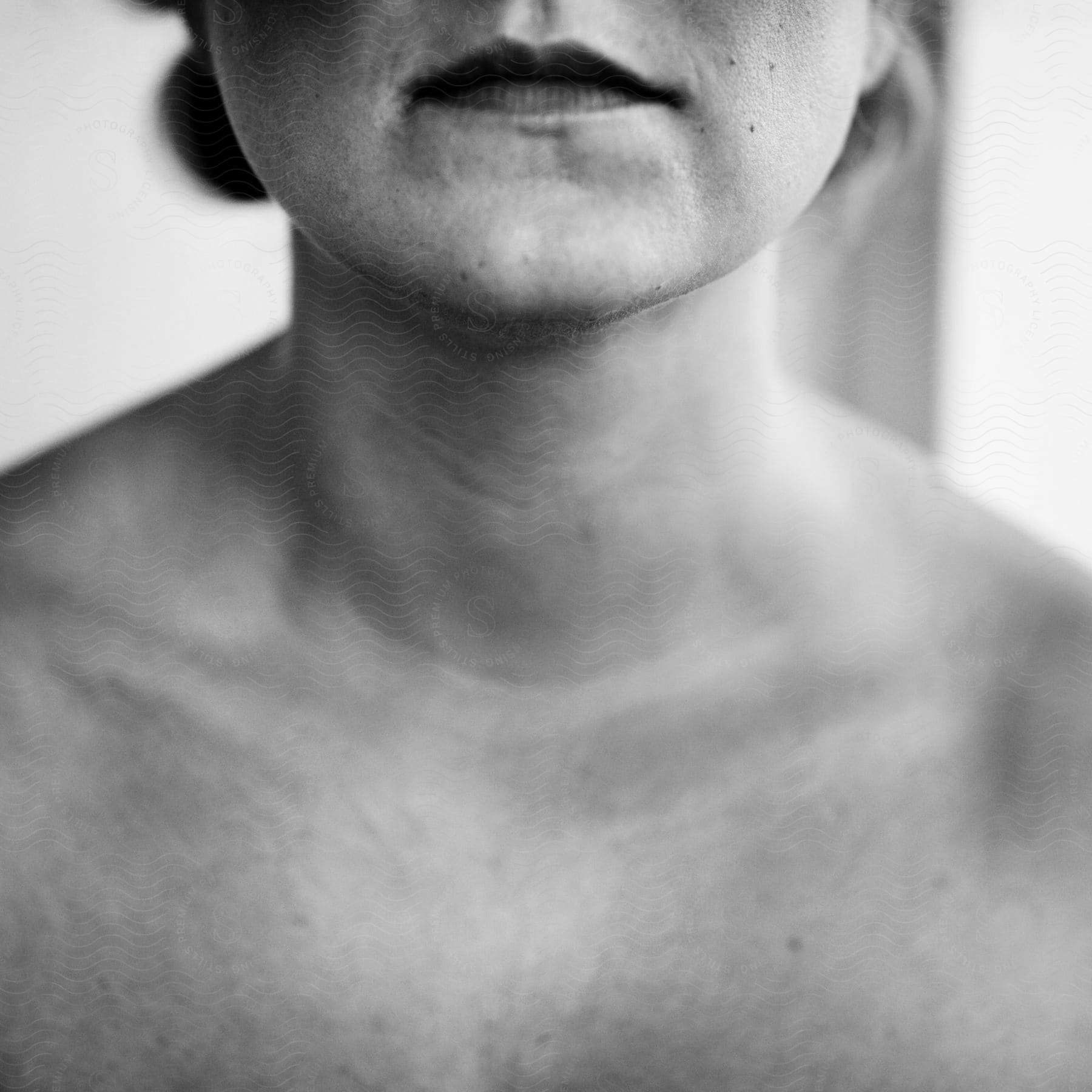 A shirtless white woman in black and white