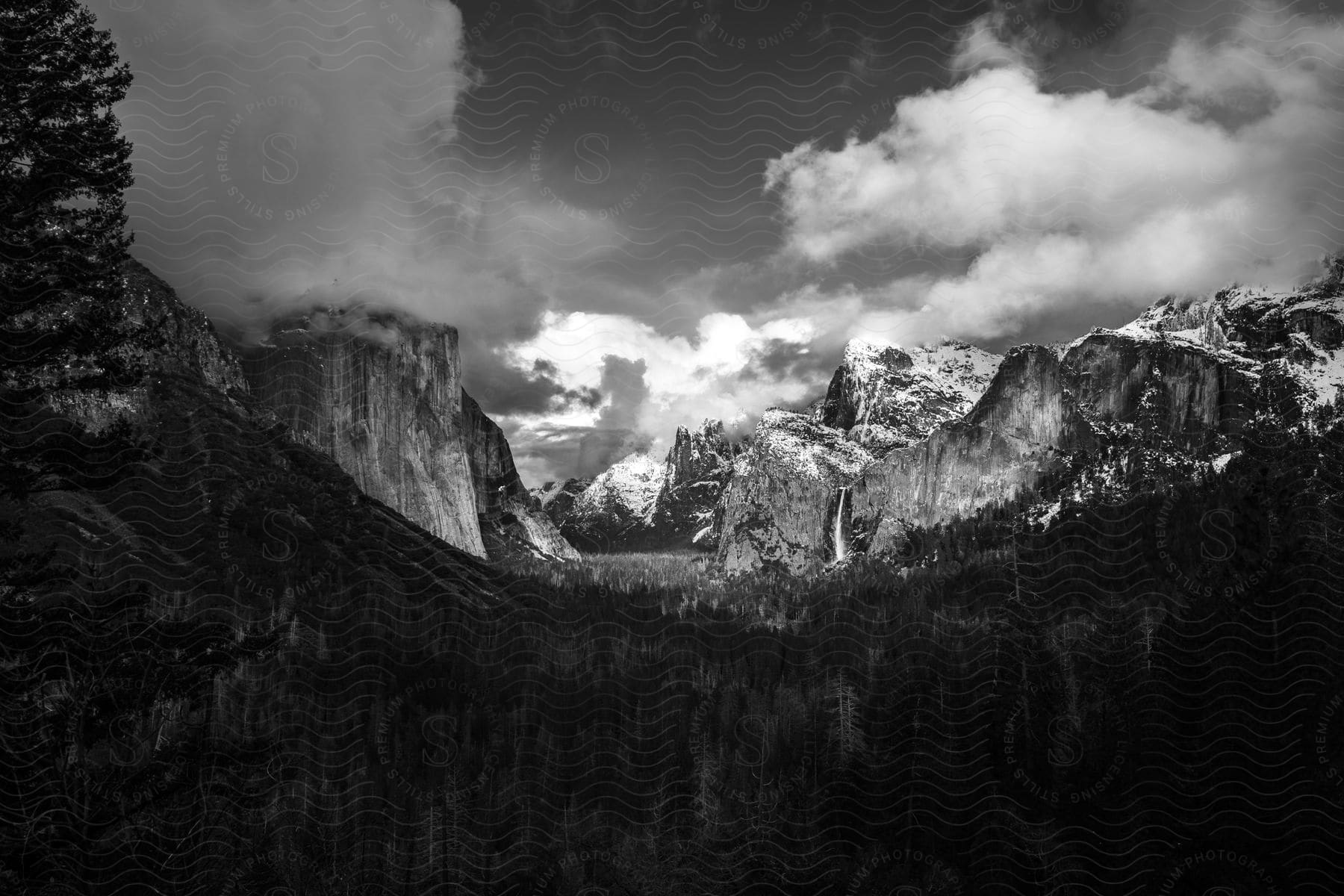 Mountains in black and white under cloudy skies