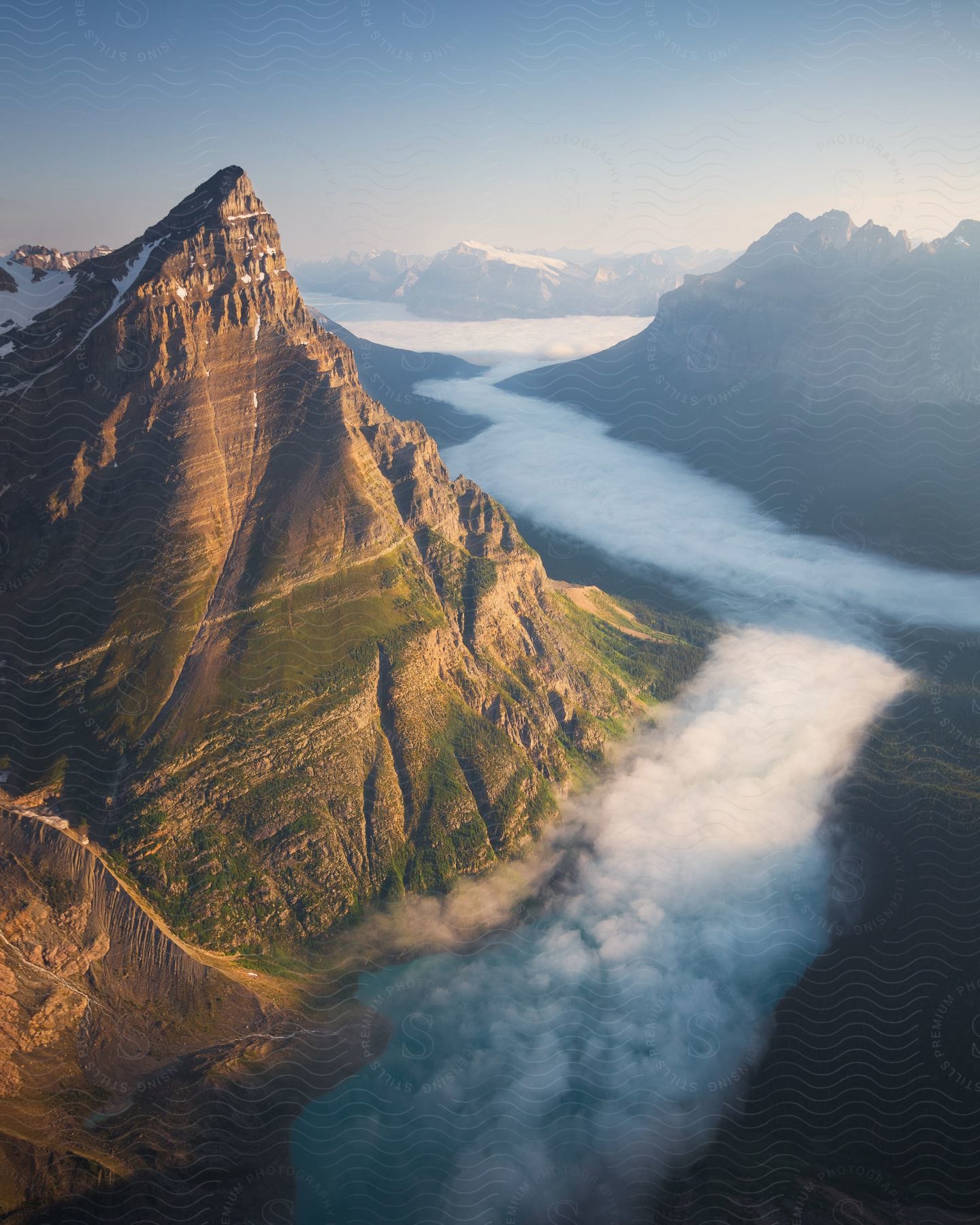 Aerial view of mountains at sunrise with fogfilled valleys in banff national park canada