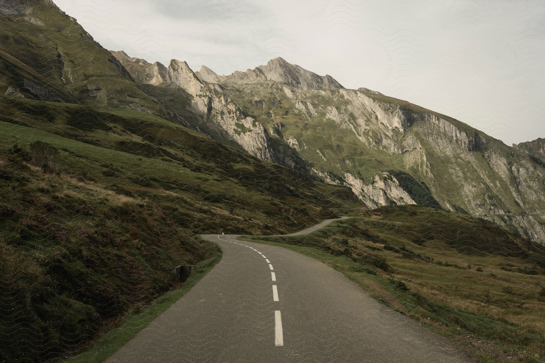 An asphalt road in the middle of a mountain range