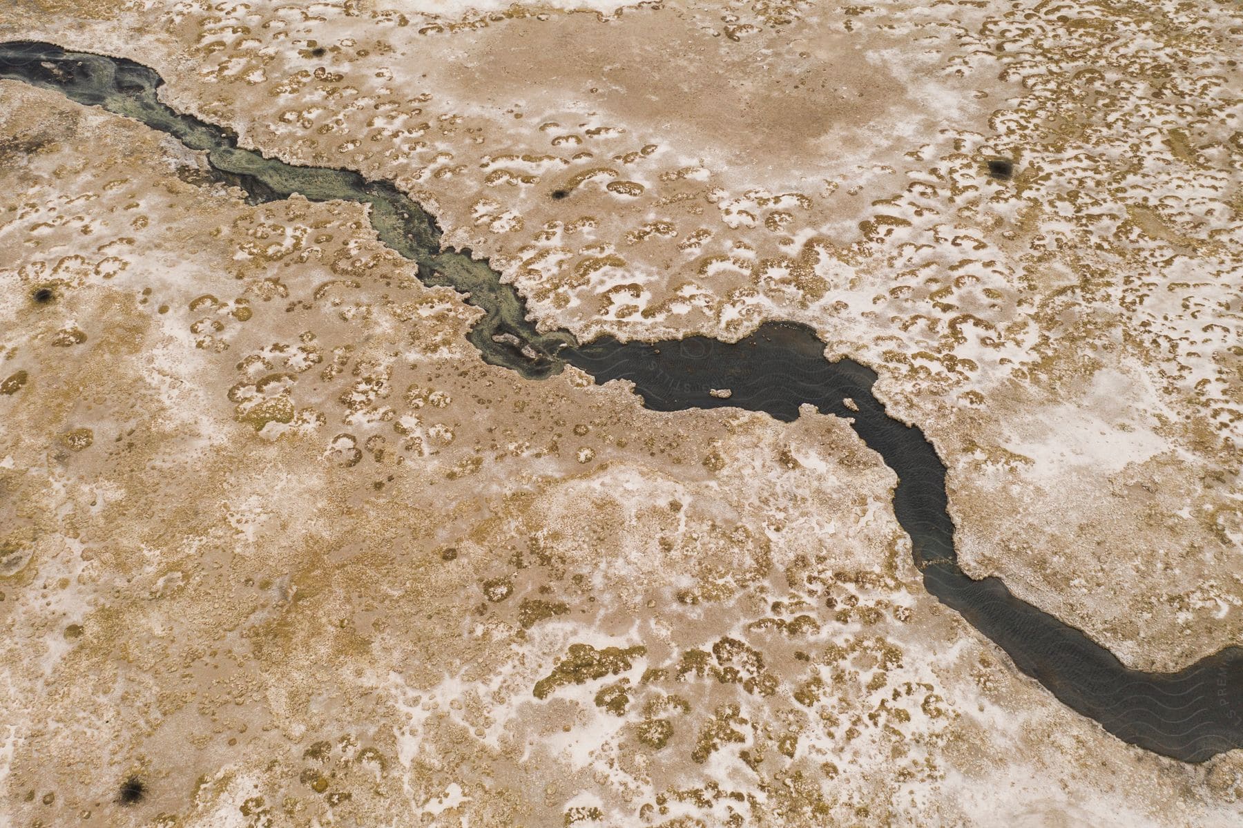 Aerial view of a stream of oil spills