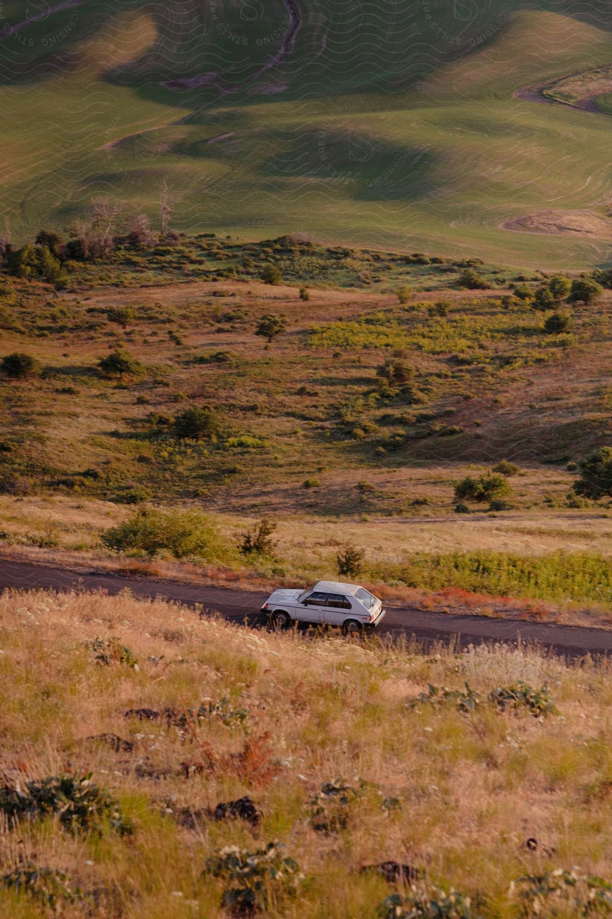 A car wheel on a gravel road in a natural landscape