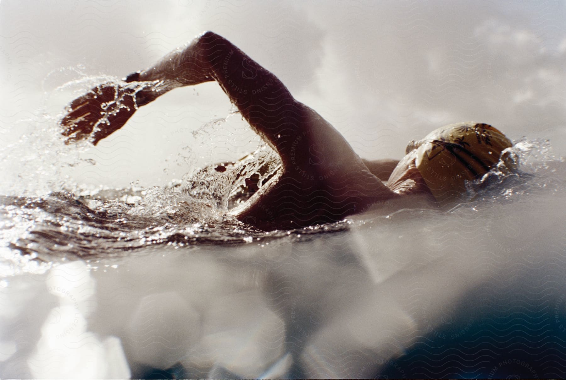 A person swimming from water level