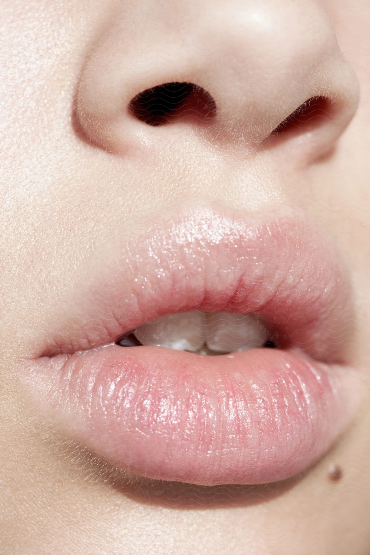 An ultra close up of a persons mouth and nose