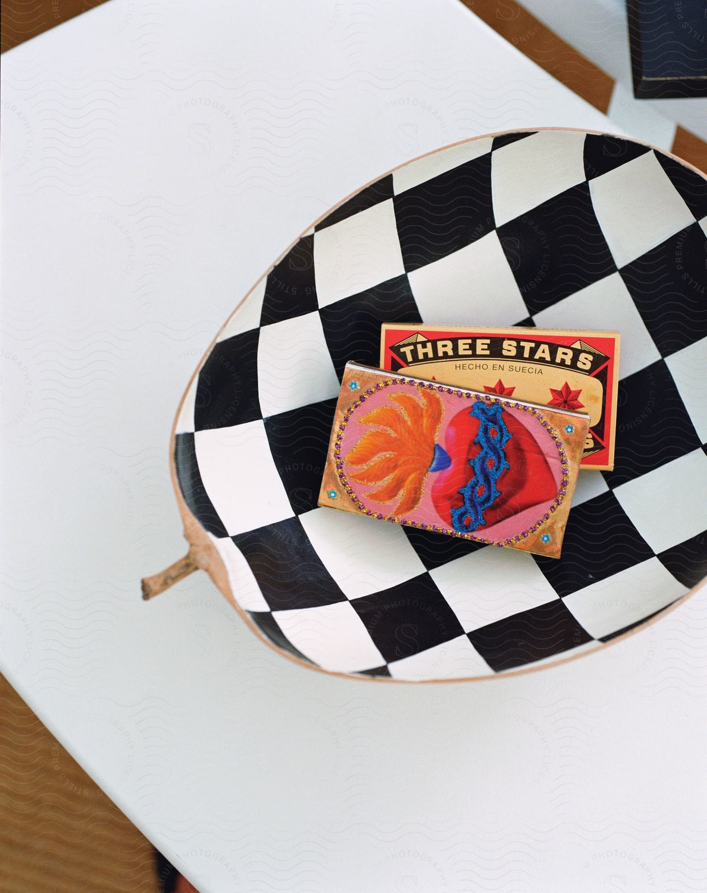 Wooden boards with colorful drawings on a white table