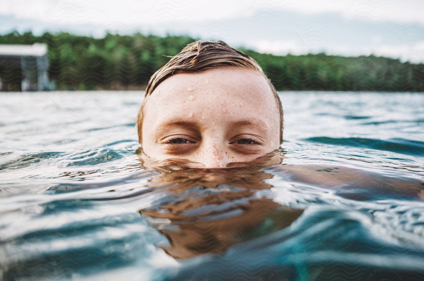 A child swimming in a pool during springtime