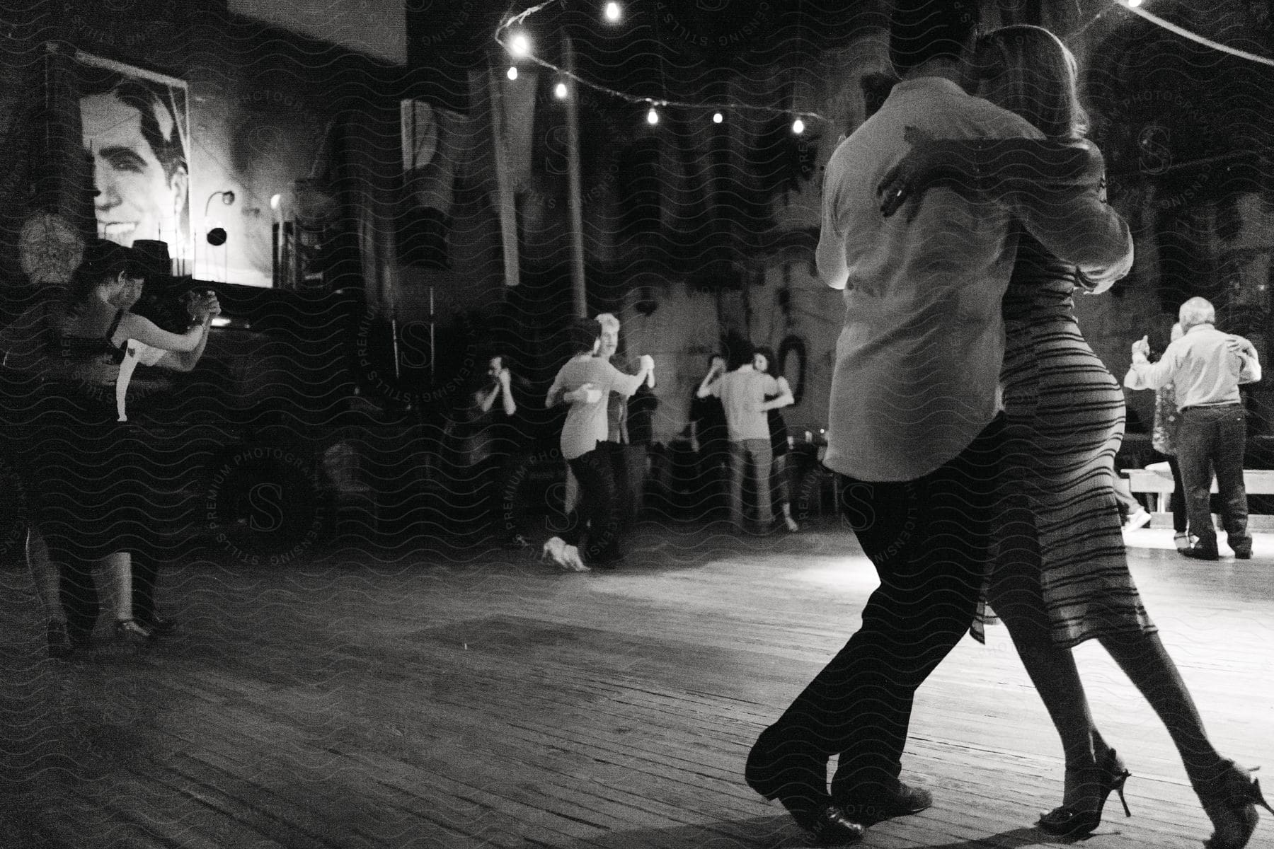 Couples dancing in a ballroom