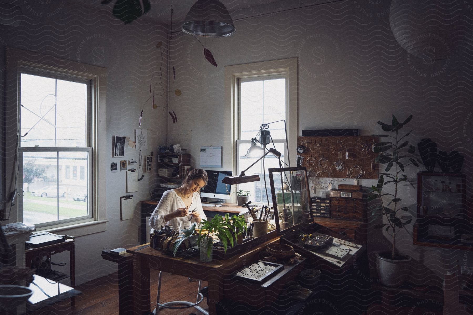 Blonde Woman Making Jewelry Indoors