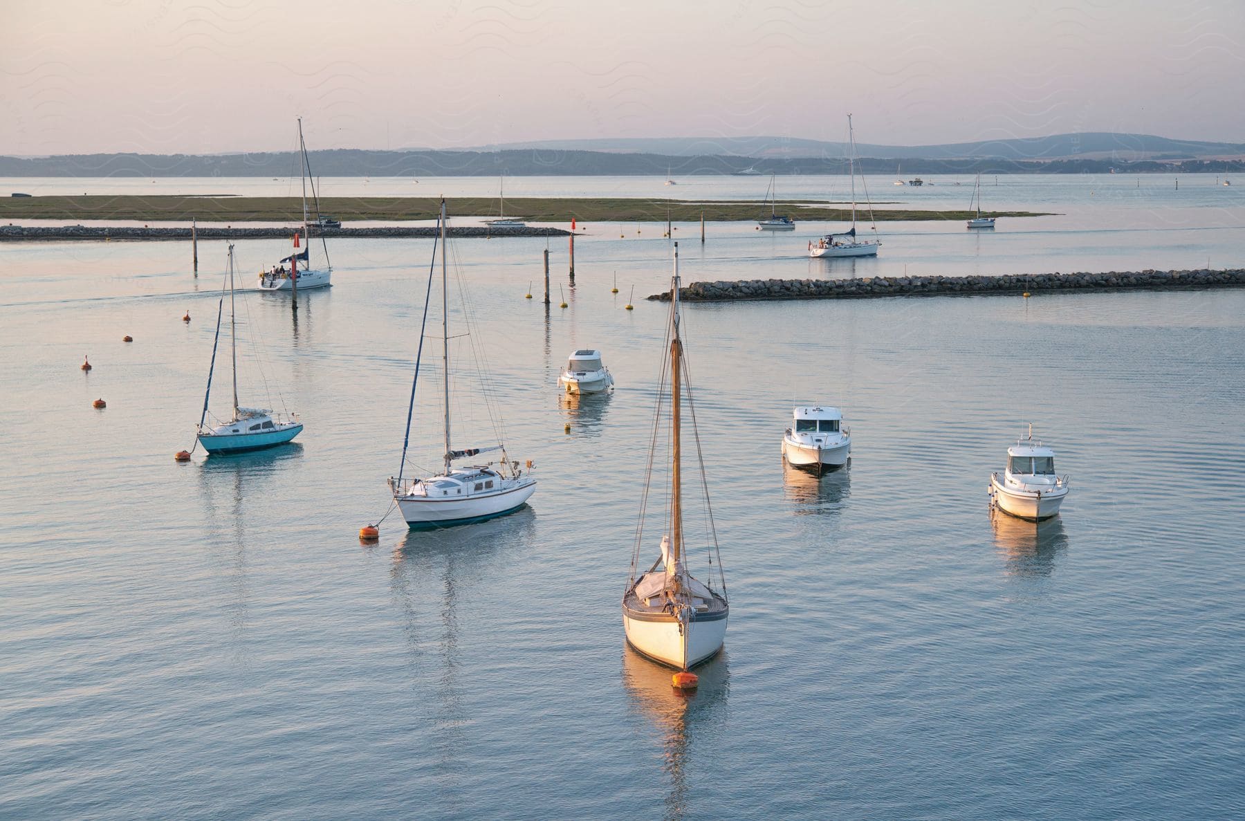 Coastal landscape with yachts and mountains on the horizon