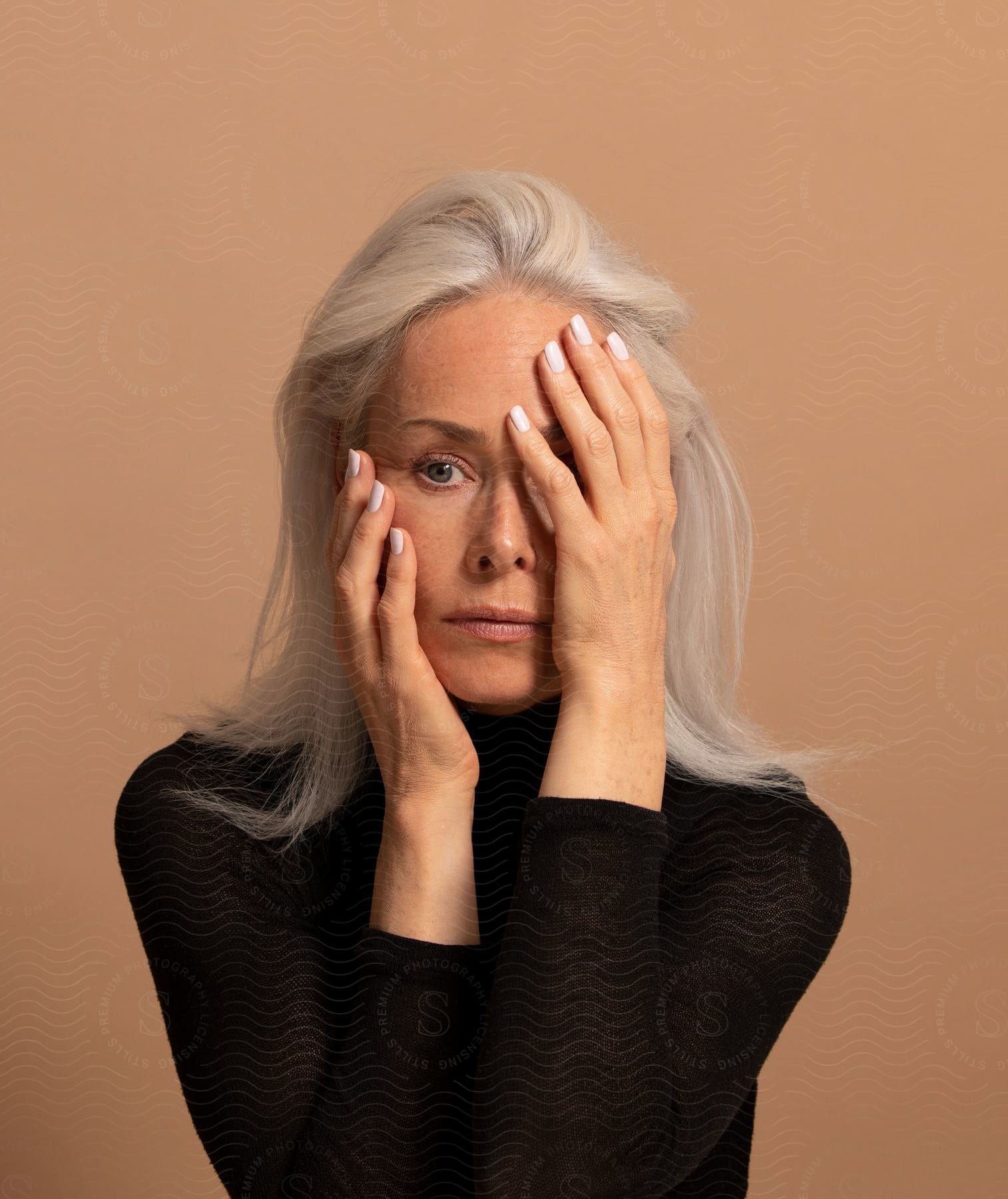 A womans face with a dress and hand gesture