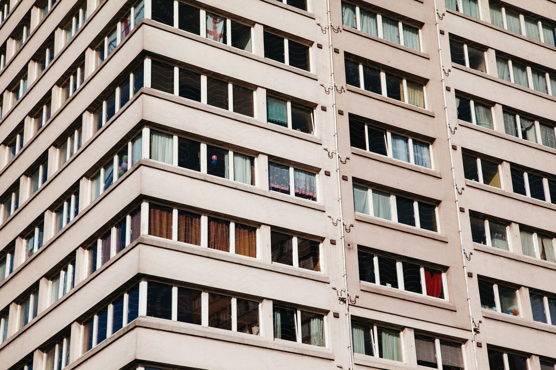 A large building with many windows in an urban area