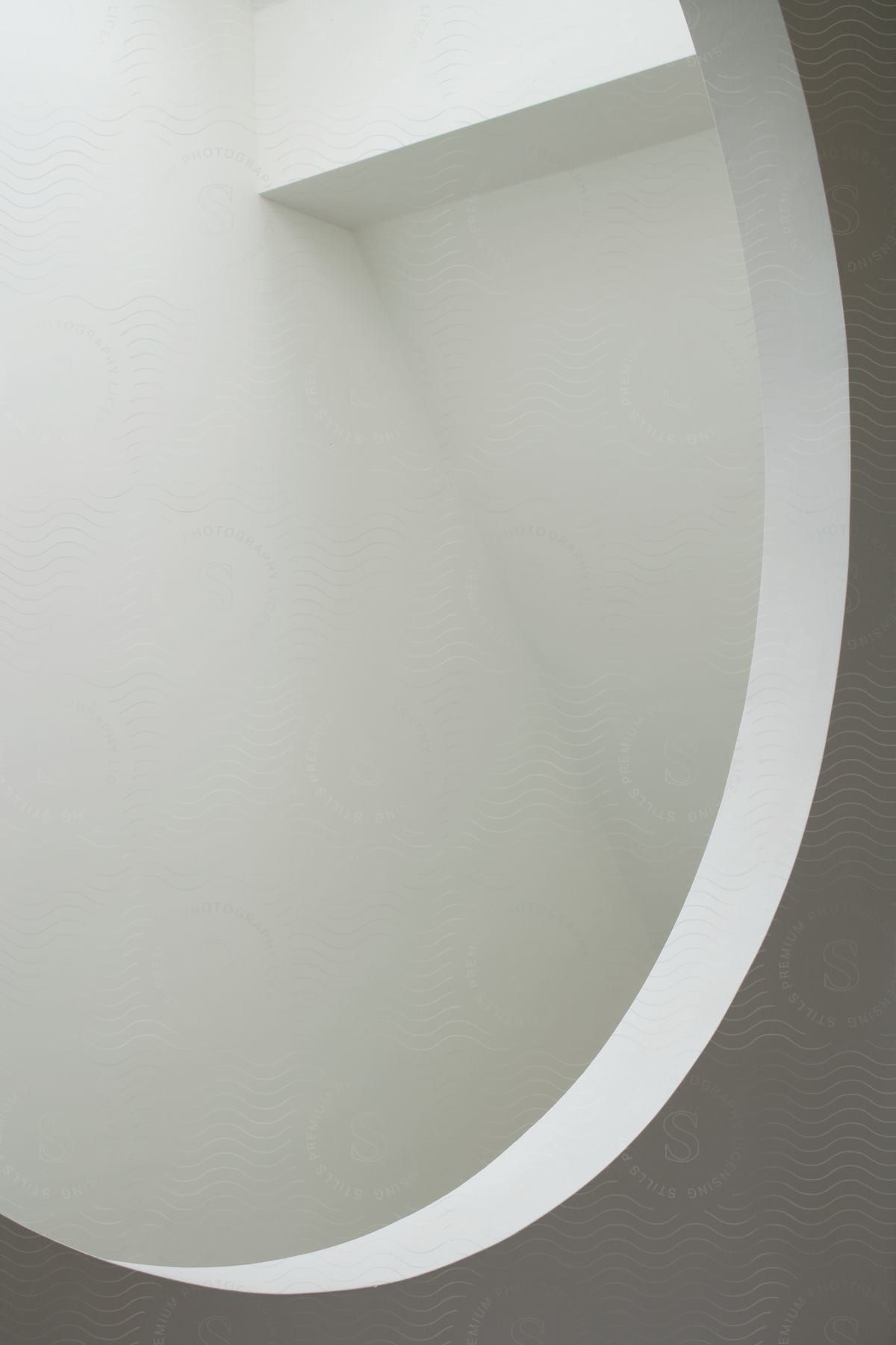 Abstract white interior architecture with a large hole in the wall and a small space with a diagonal wall