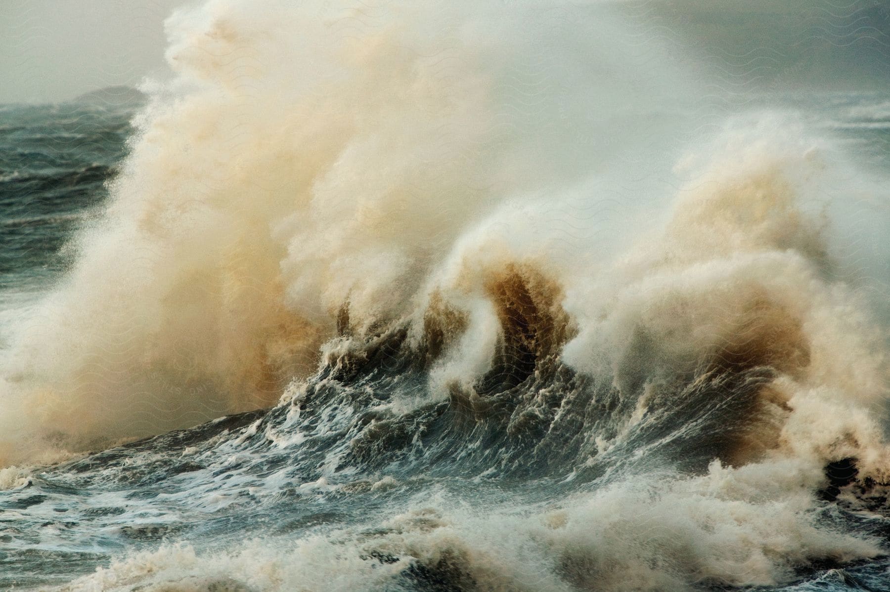 Natures power in the form of sea waves crashing against the shore