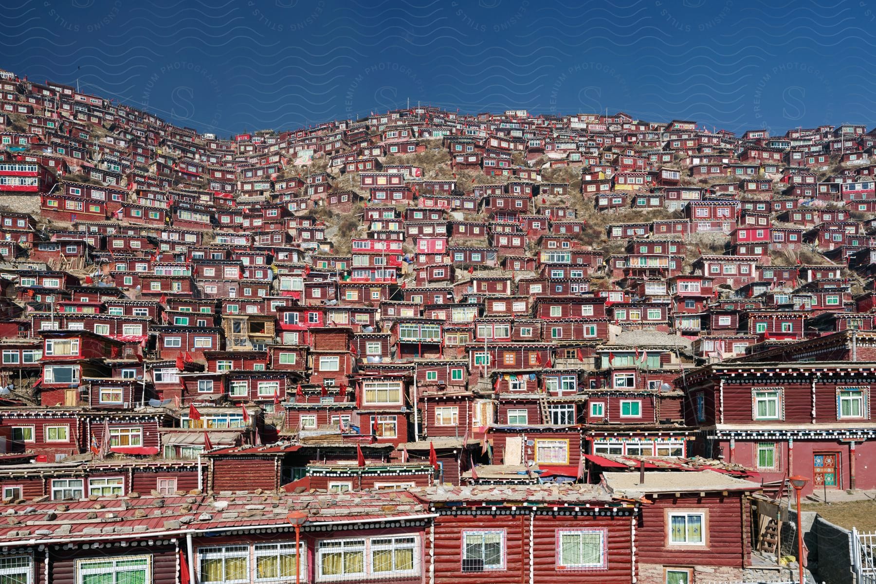 A cluster of houses on hilly terrain