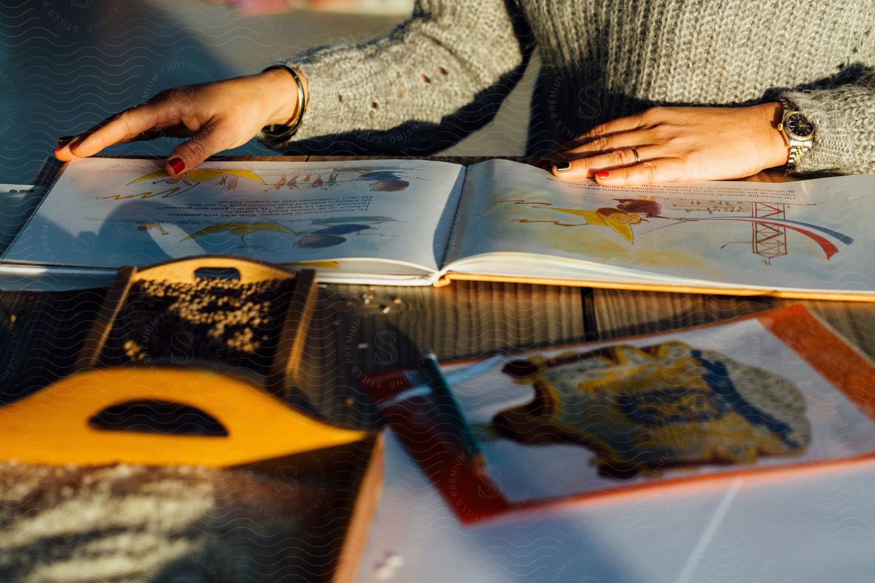 A woman reading a childrens book