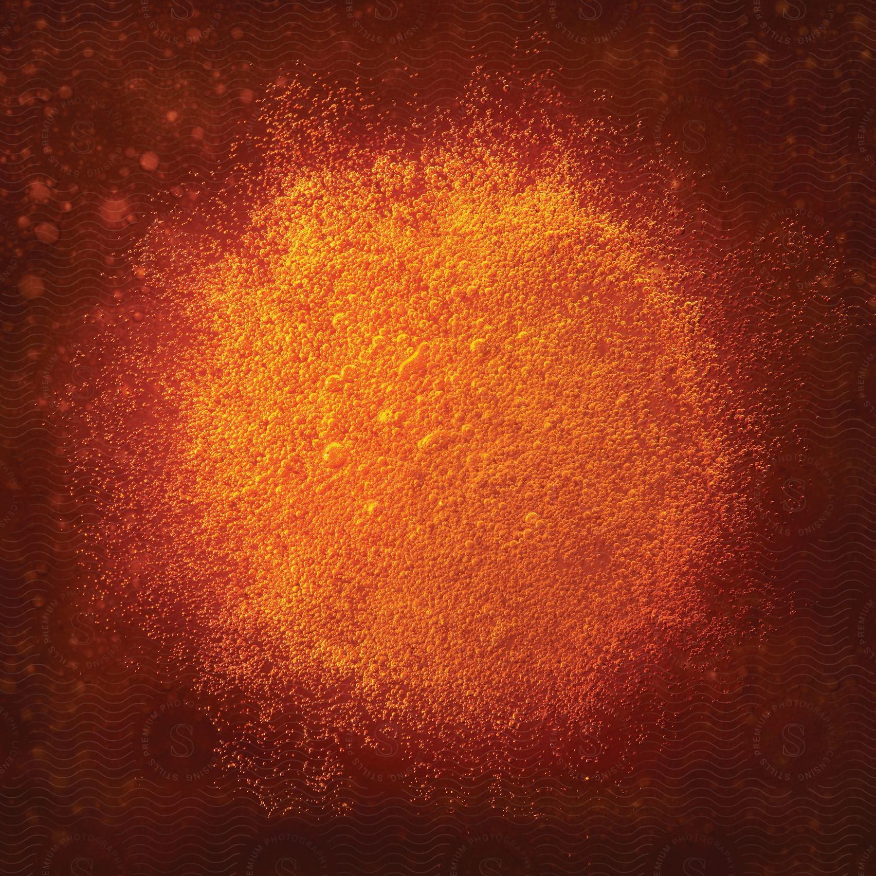 An orange bubblelike scene with galactic elements