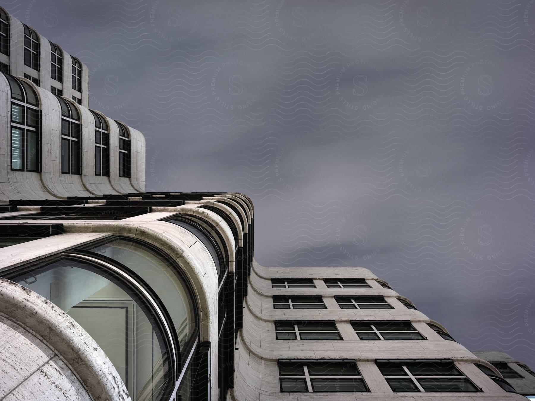 Exterior of apartment building with clouds in the background