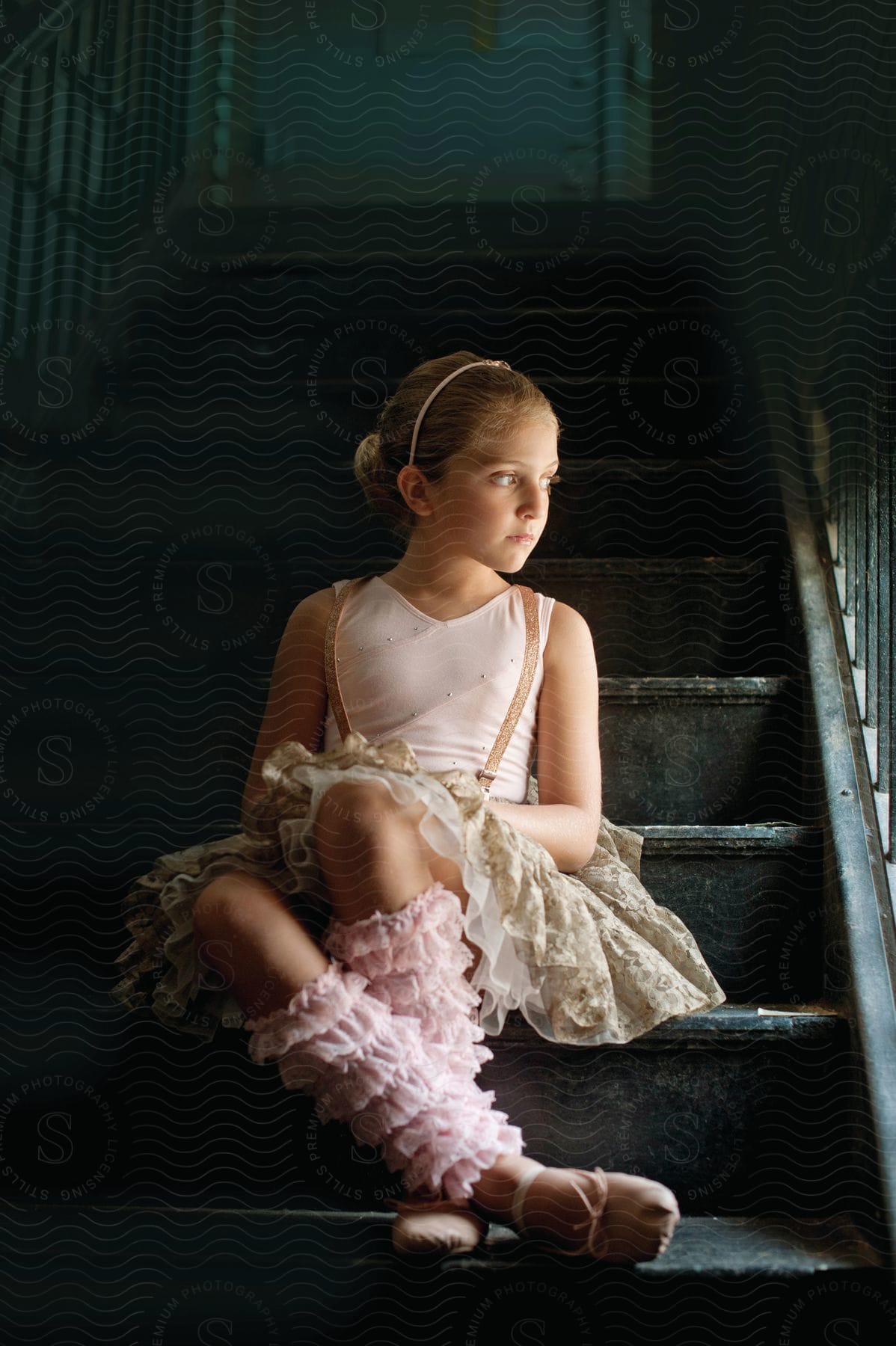 A Young Girl Sitting On Stairs