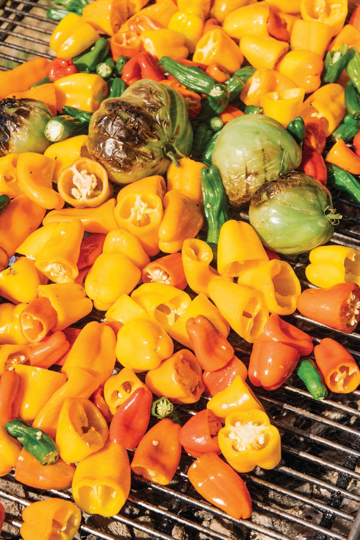 Close up of grilling peppers over an open flame