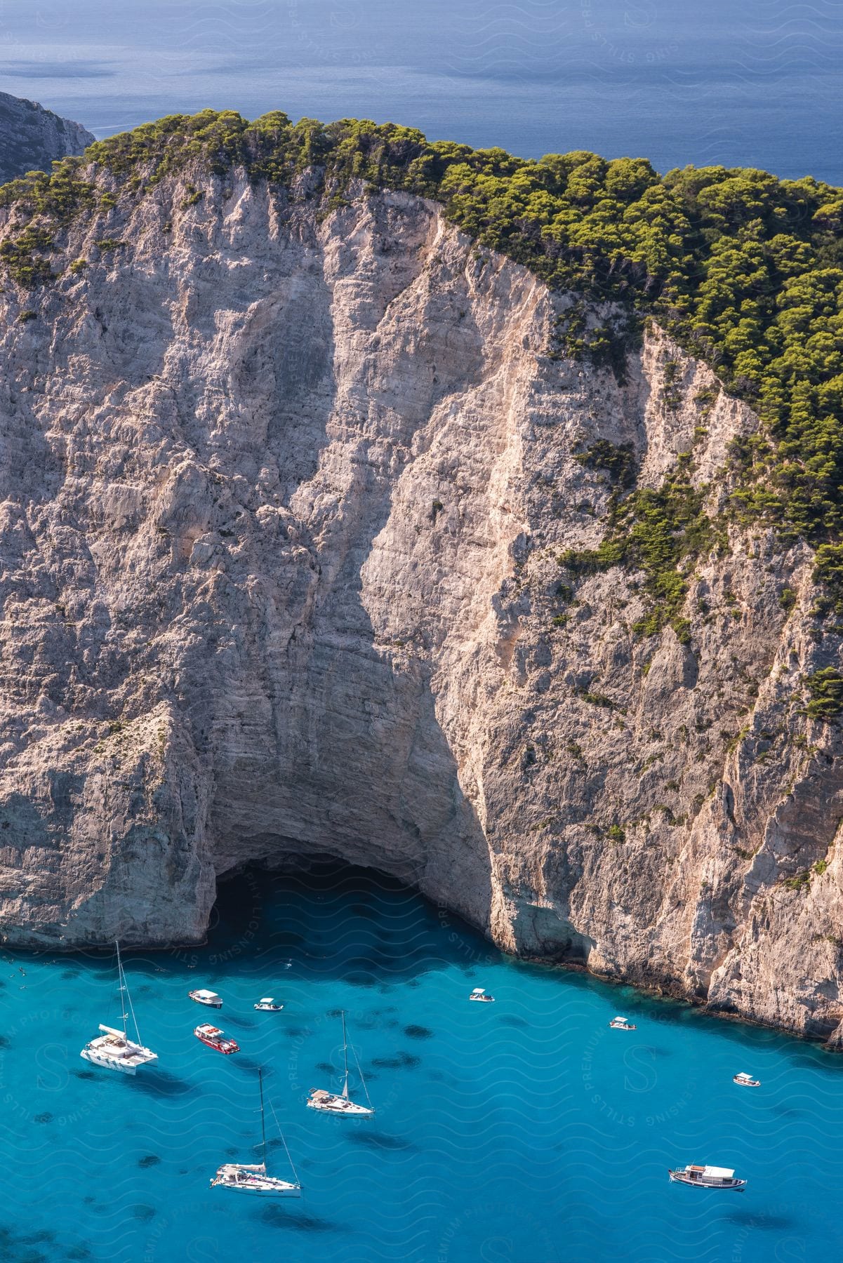 Boats driving near a rock formation