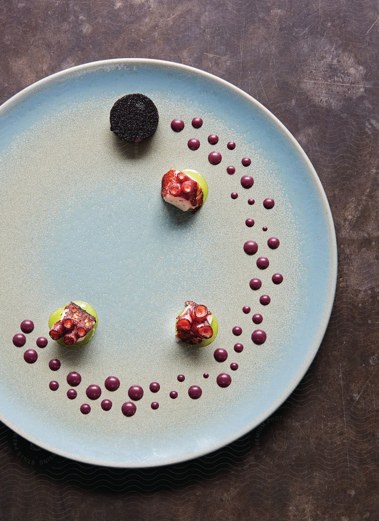 A plate of colorful food is displayed on a plate