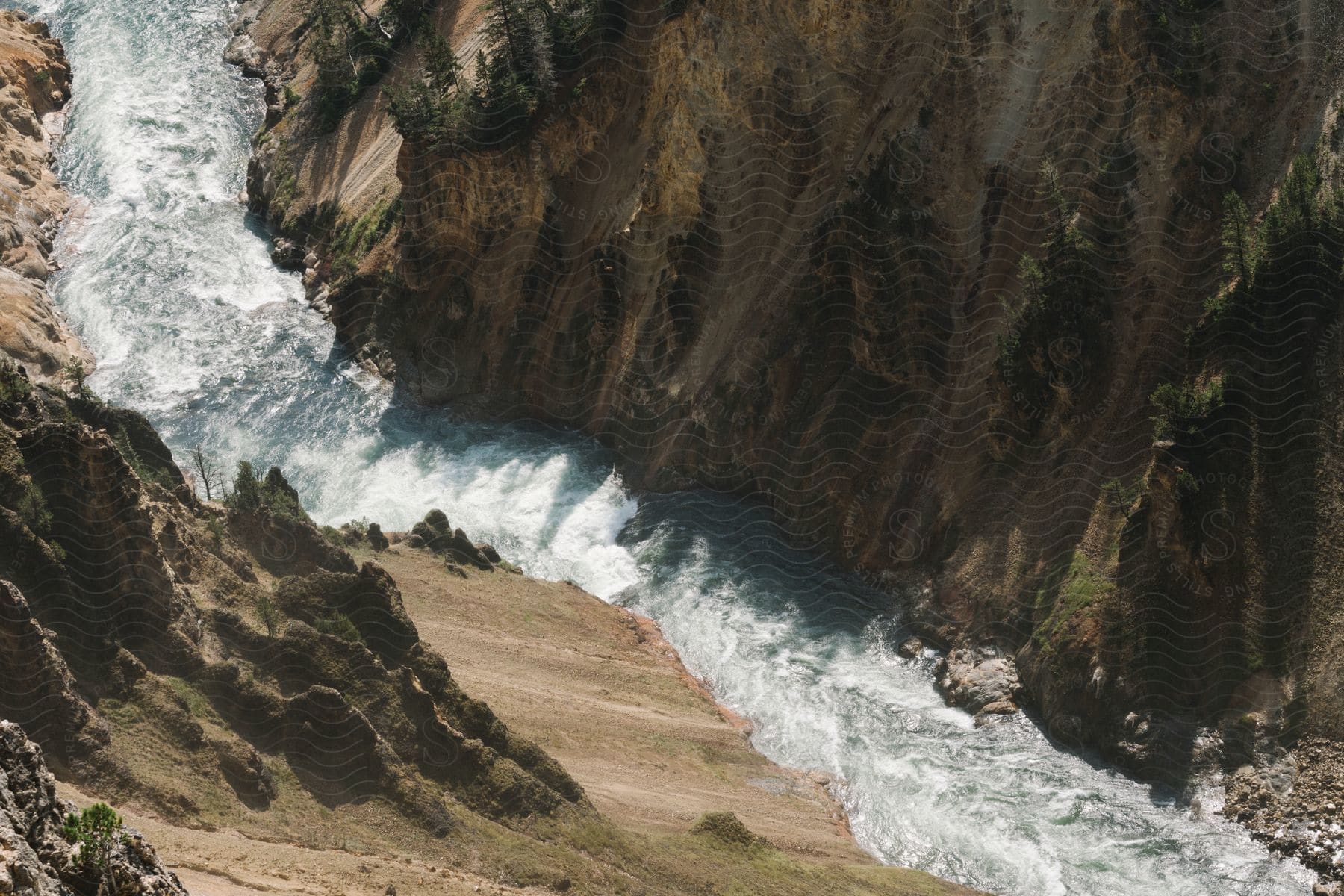 A fast stream moves through a canyon