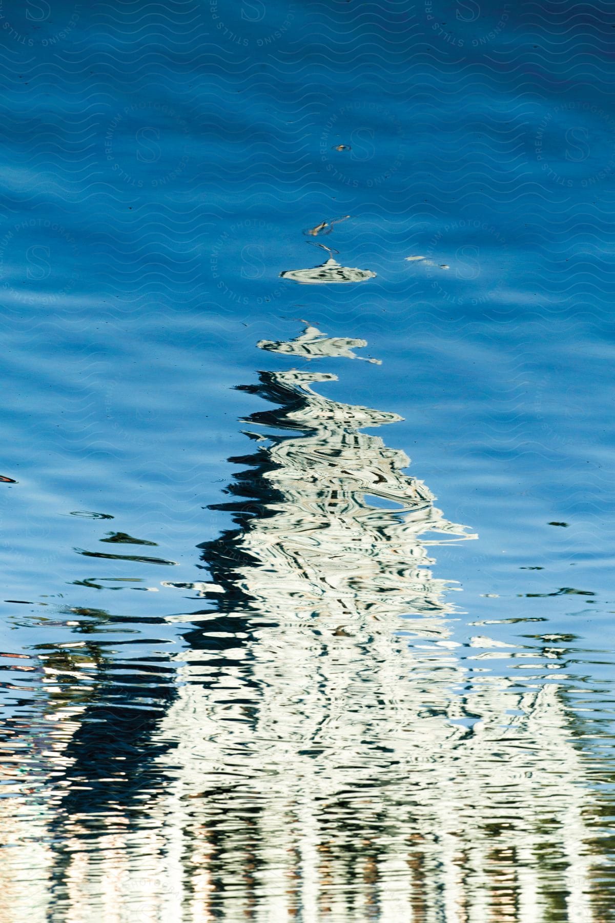 A church reflected in a rippled lake