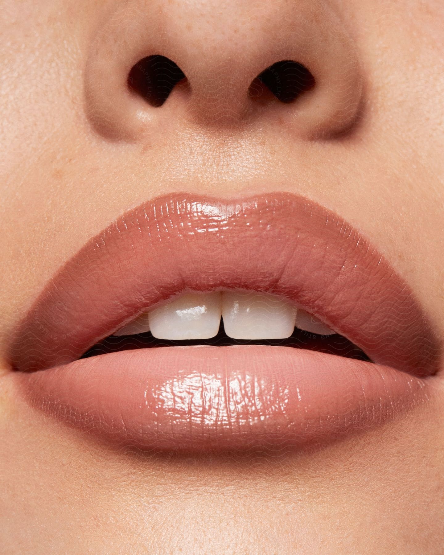 A closeup of a womans lips with lipstick applied