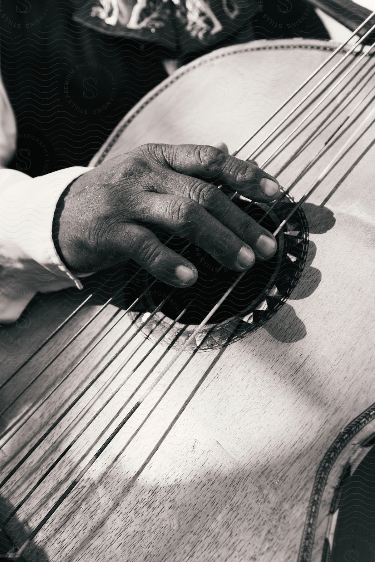 A man playing a guitar outdoors