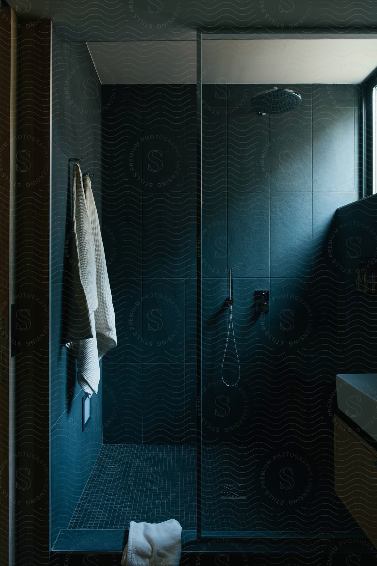 A bathroom with a shower and a shower faucet indoors