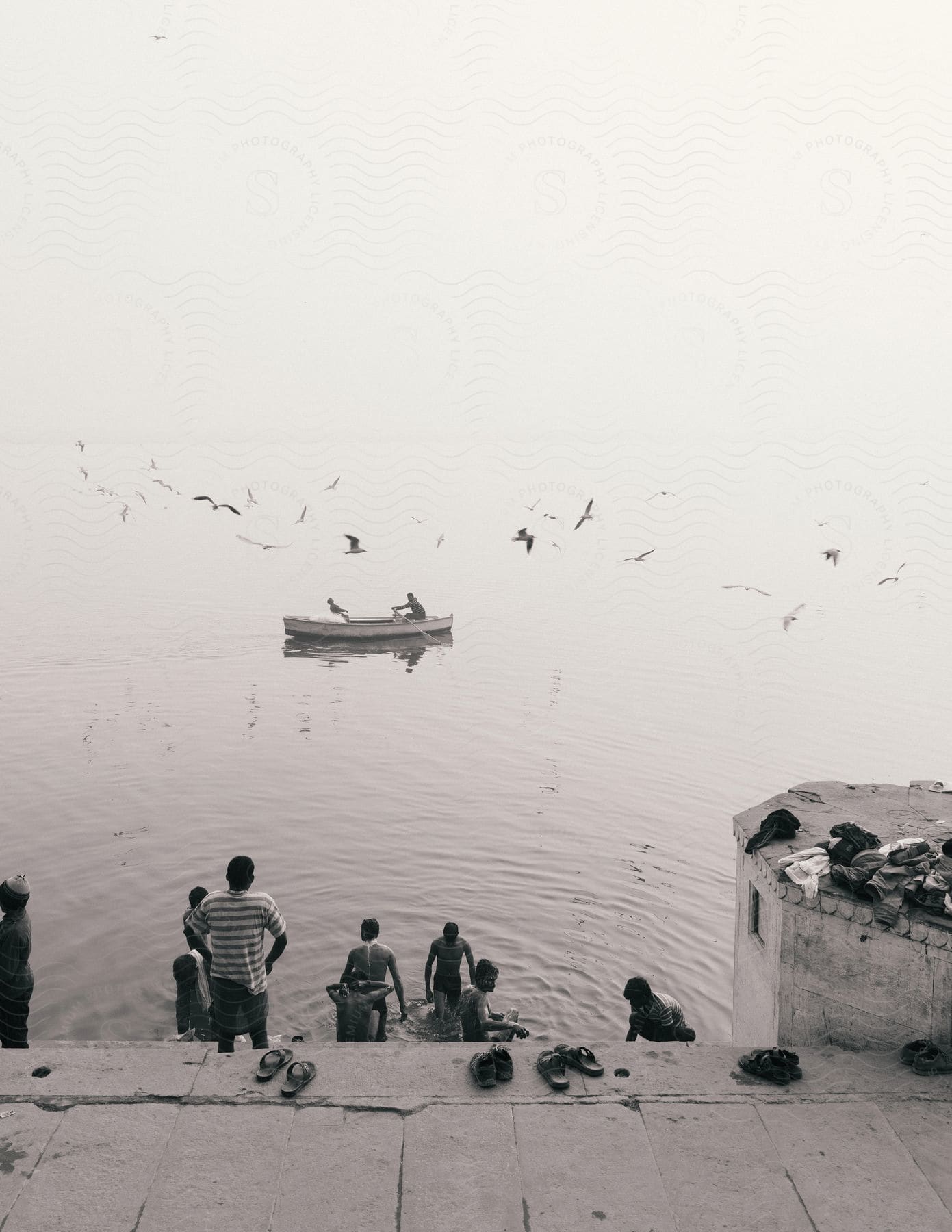 A small group of people in a boat on a lake