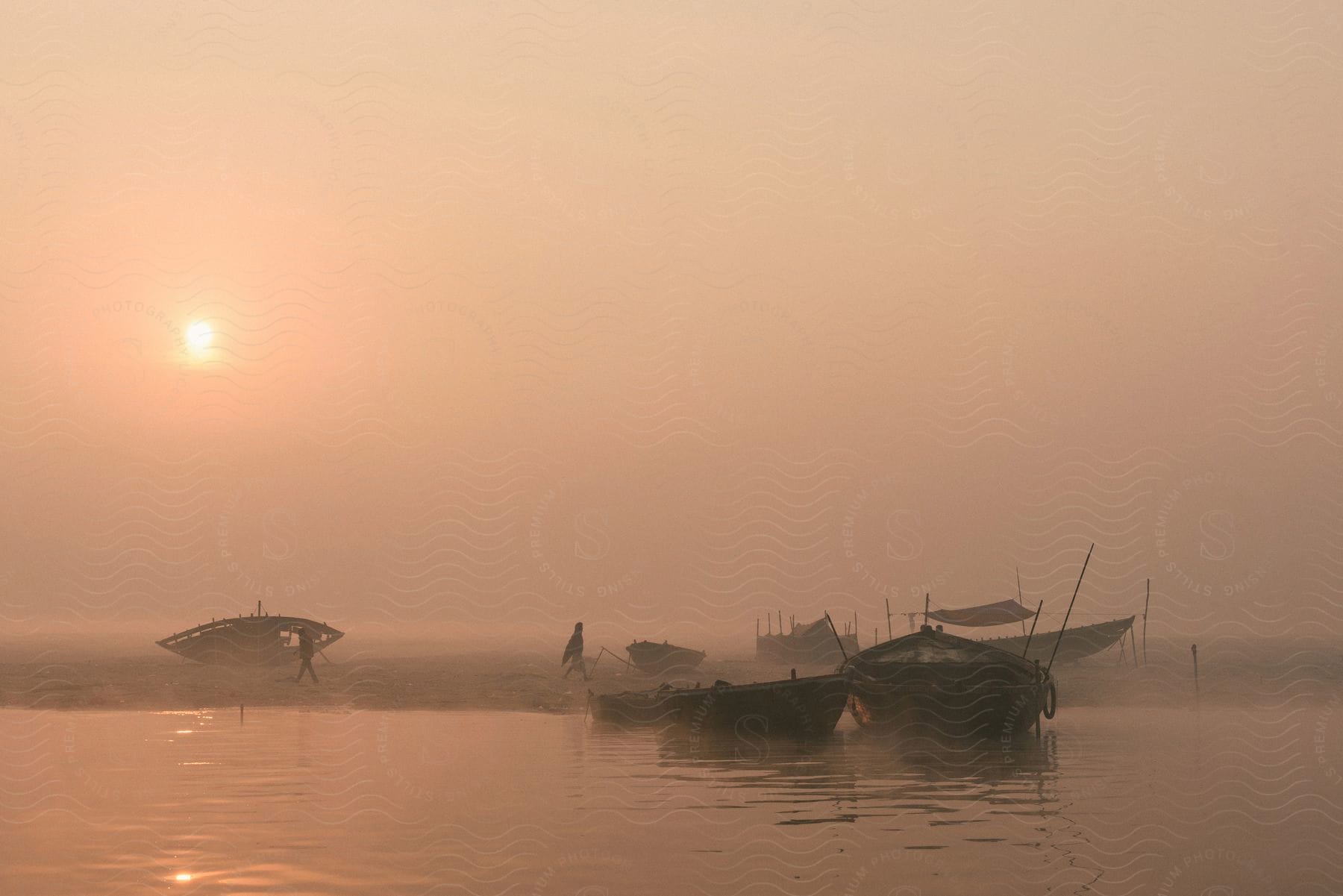 Boats on water at dusk