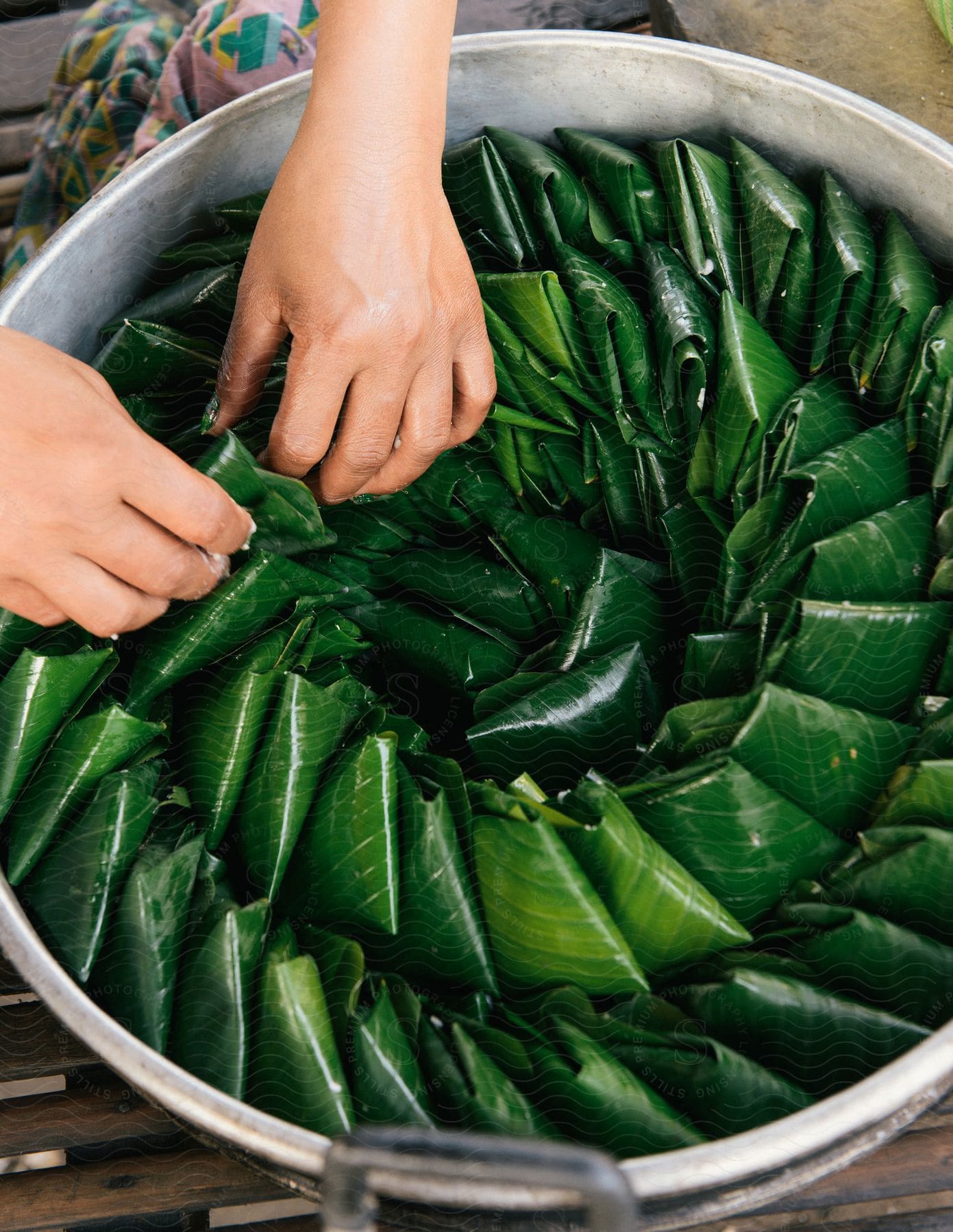 Banana leaves being prepared for cooking
