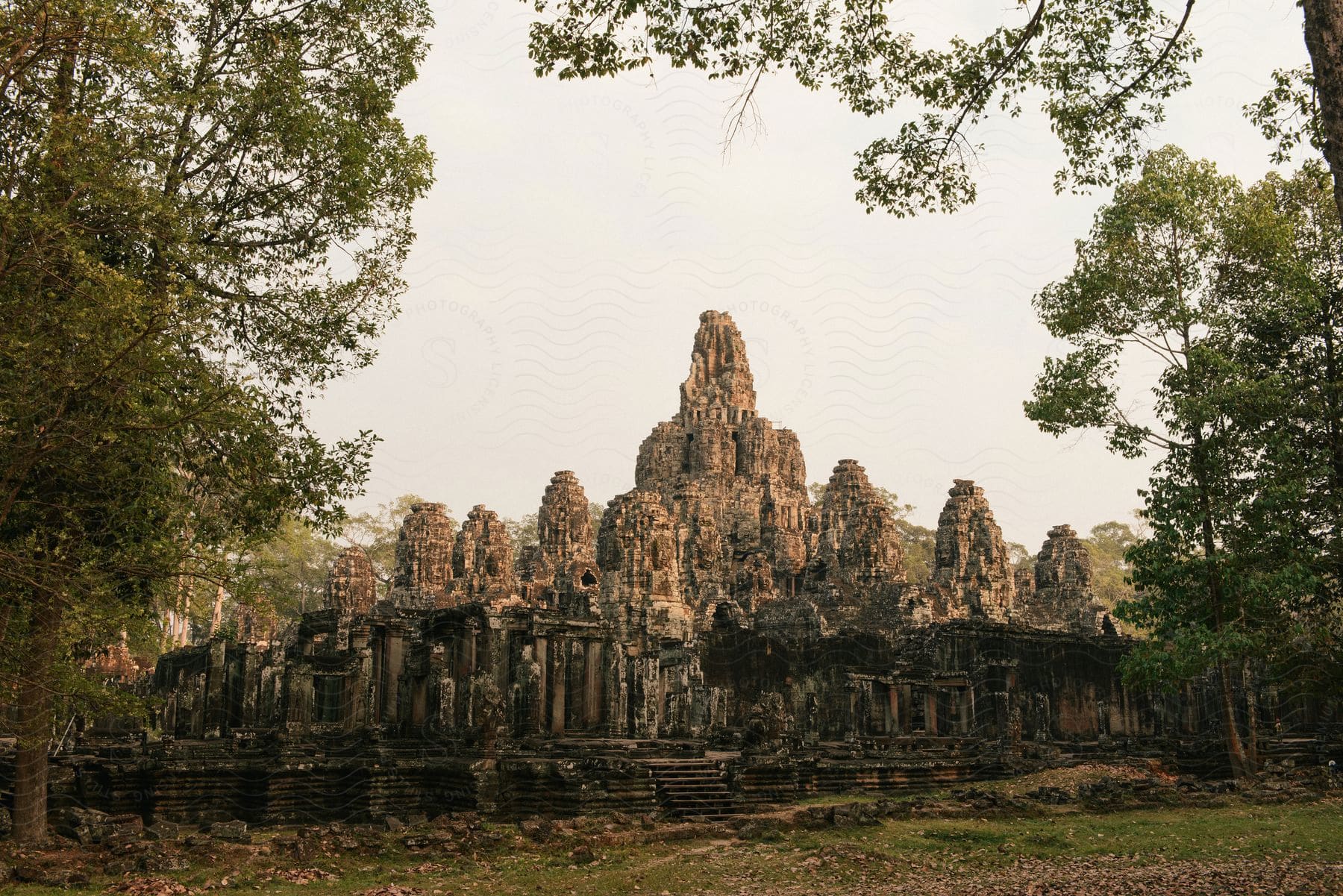 Bayon temple surrounded by trees in the forest