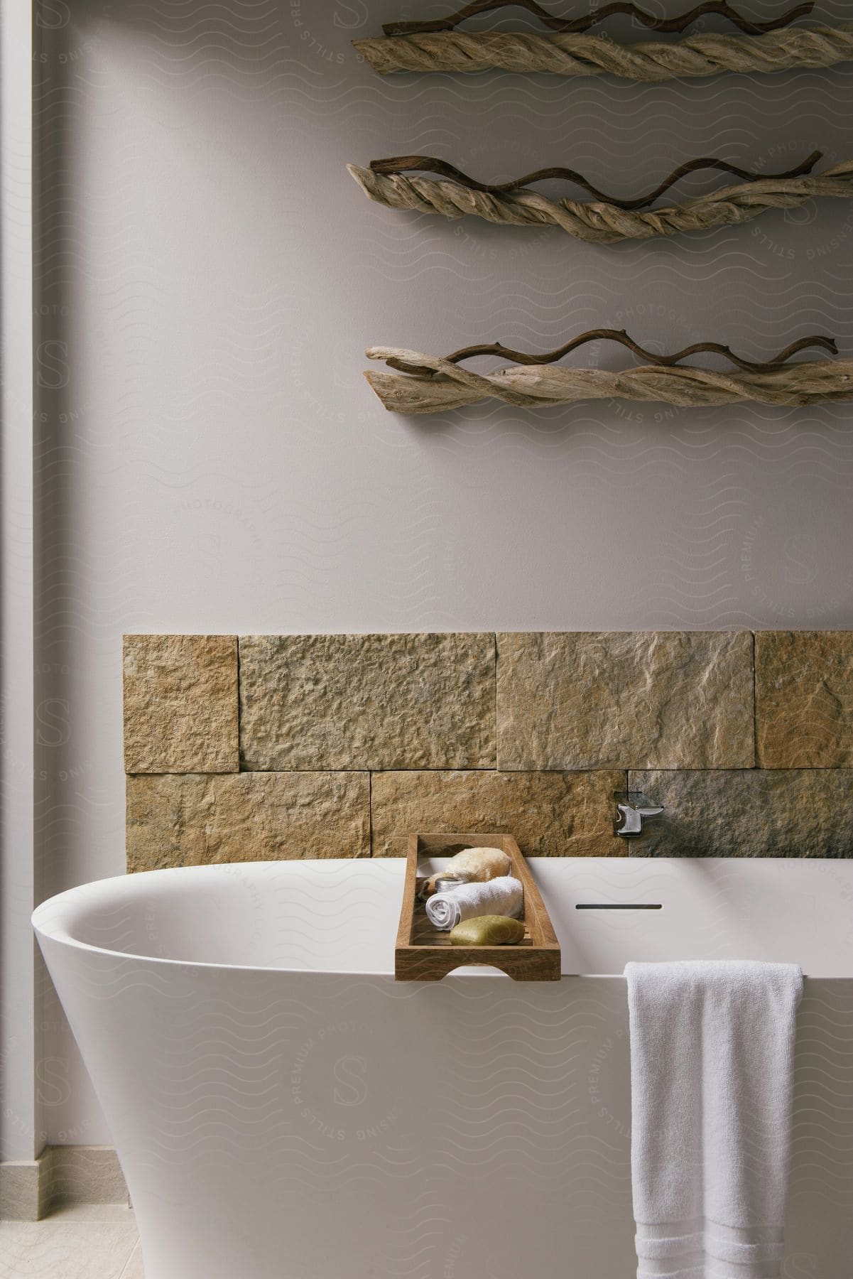 A bathroom with a bathtub and exotic wall decorations