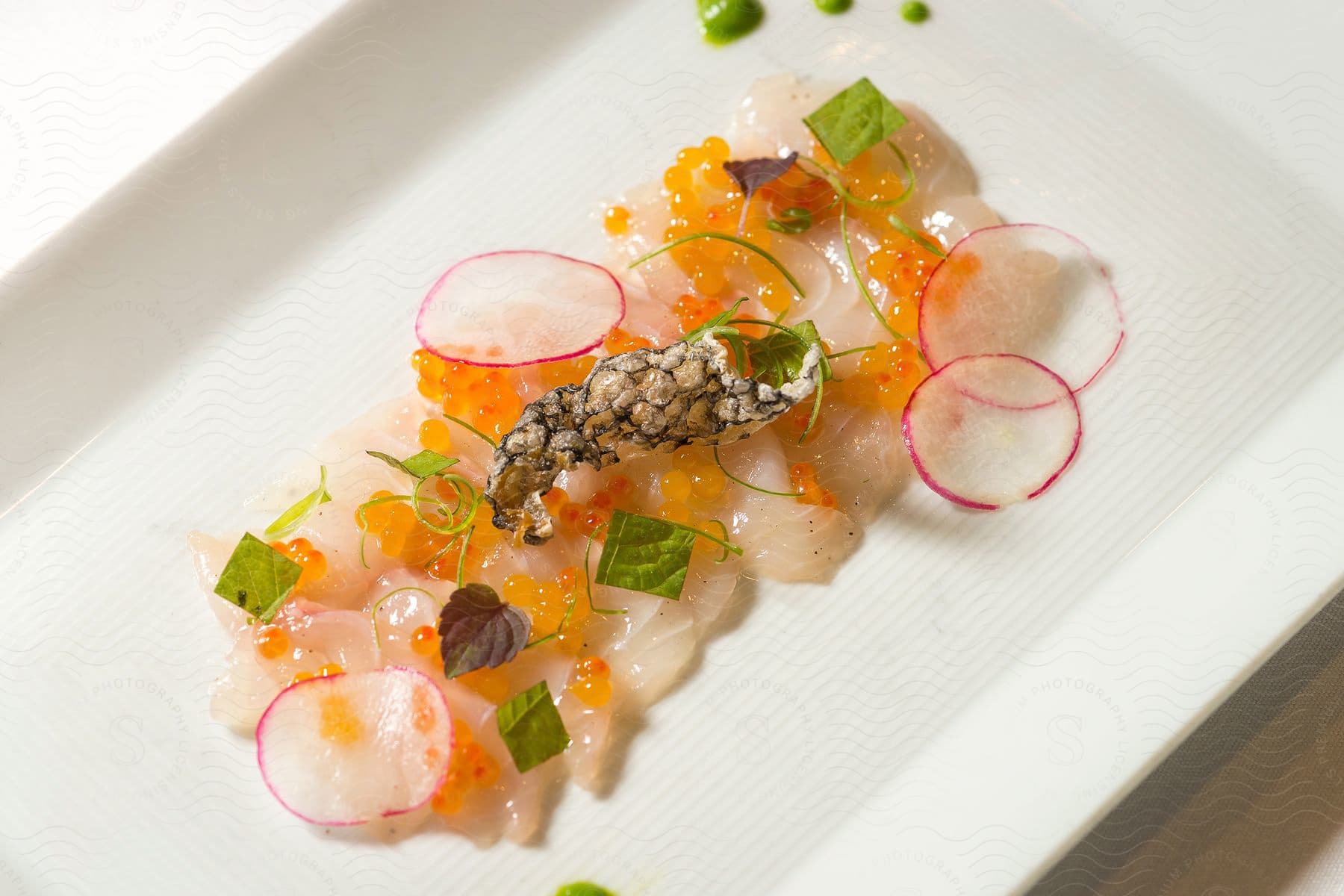 A plate of food with various ingredients and garnish