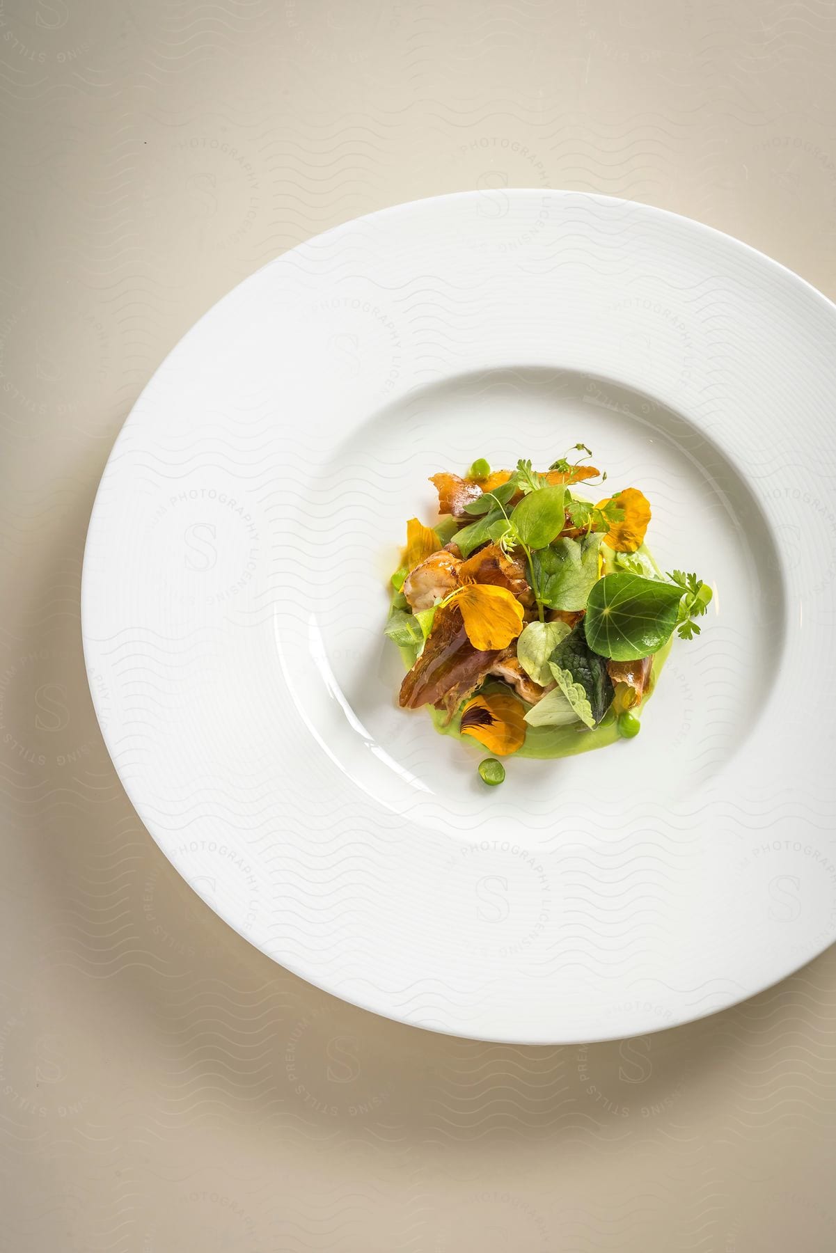 A plate of food with various ingredients and leafy greens