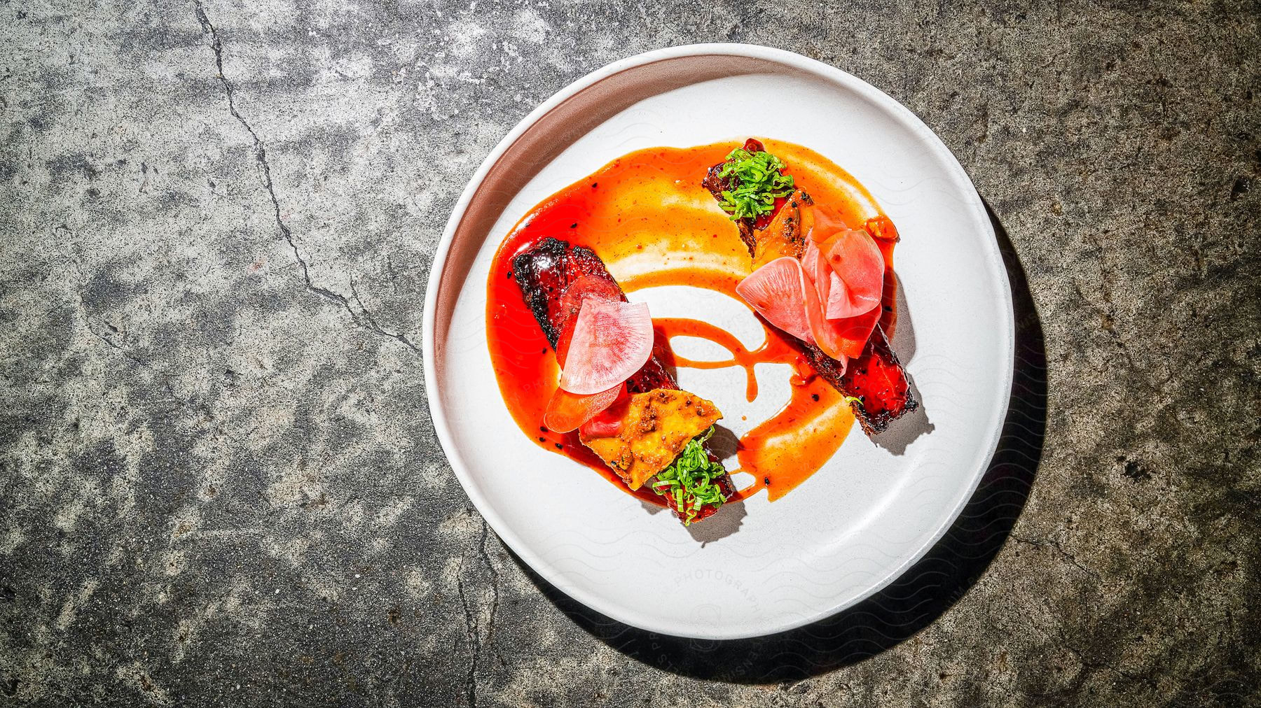 A plate of food with various ingredients and tableware