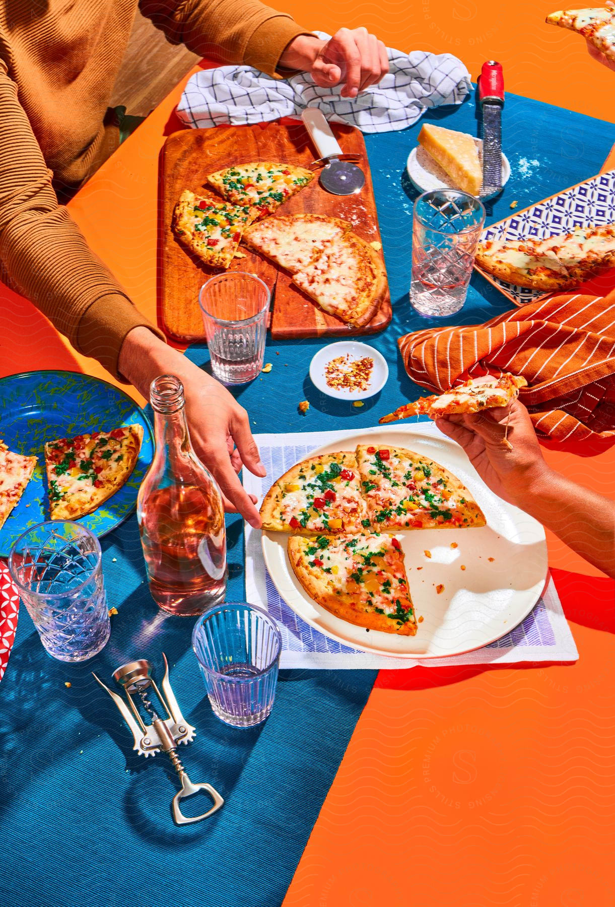 Stock photo of a person eats pizza with handgrated cheese