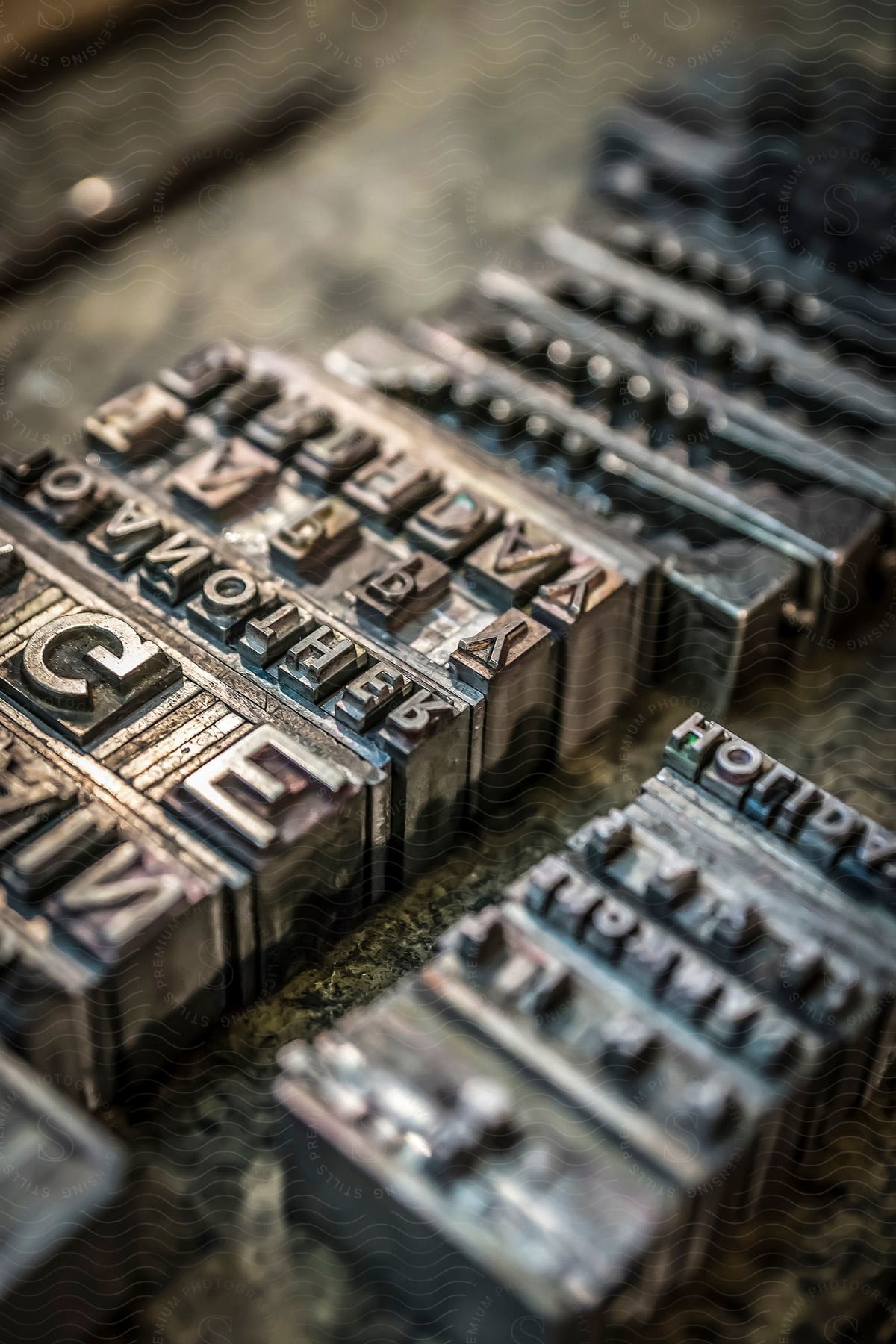 Old typography printing machine die cut word stamps in different sizes and fonts